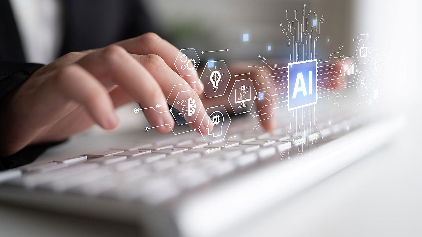 Hands typing on a keyboard with a graphic overlay of various AI related images.