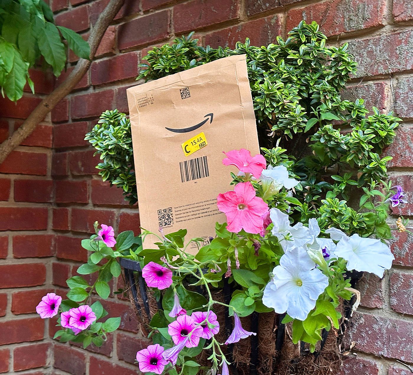 An Amazon delivery left outside front door in a flower pot.