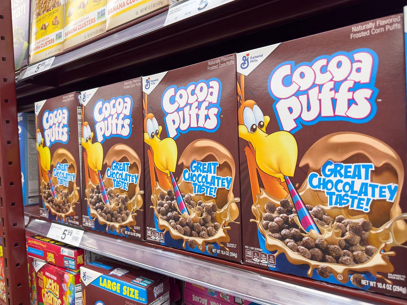 Photo of Cocoa Puffs cereal on a grocery store shelf.