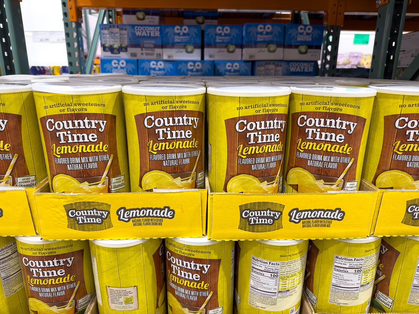 Cans of Country Time Lemonade stacked at a Costco