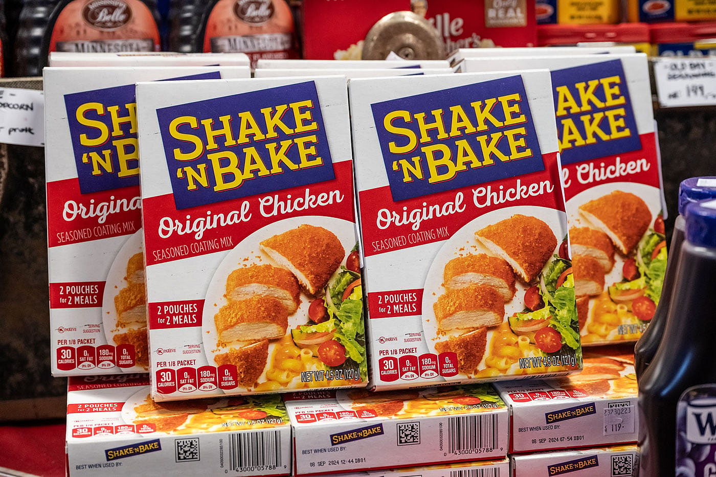 Boxes of Shake 'n Bake at a grocery store.