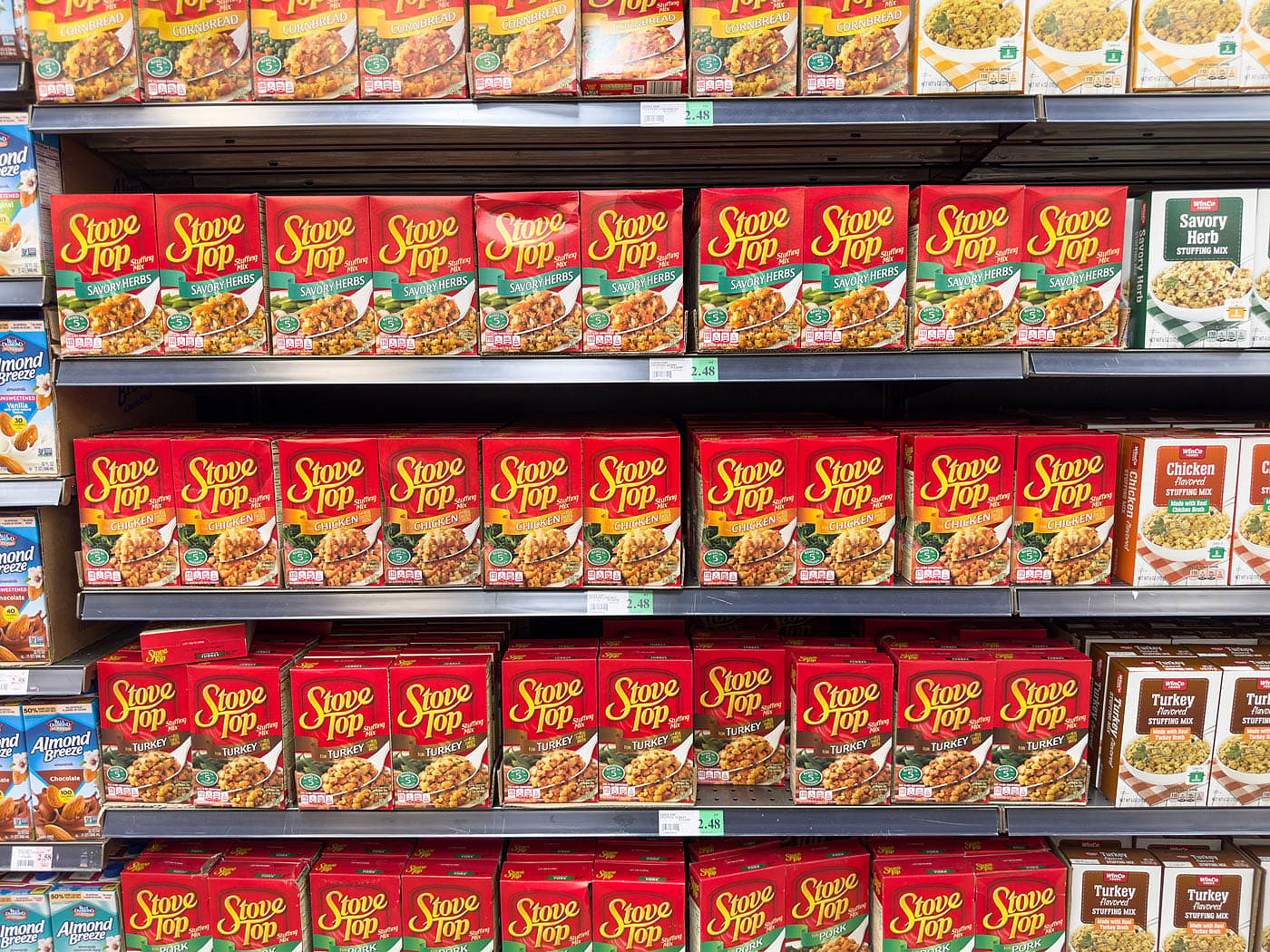 Boxes of various flavors of Stove Top Stuffing on a grocery store shelf.