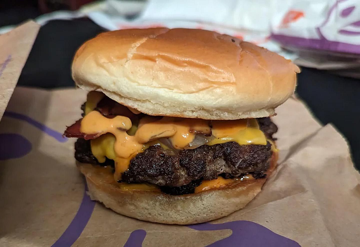 Photo of a Bacon Double Smashed Jack from Jack in the Box sitting on a wrapper