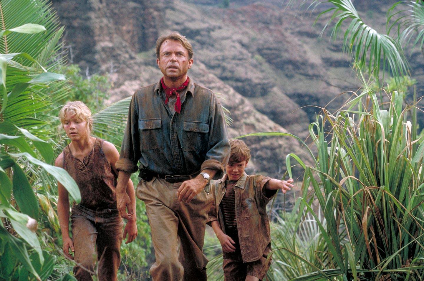 Actor Sam Neill as Dr. Alan Grant, with Ariana Richards (left) and Joseph Mazzello (right) as Lex and Tim, in a scene from the film 'Jurassic Park', 1993.
