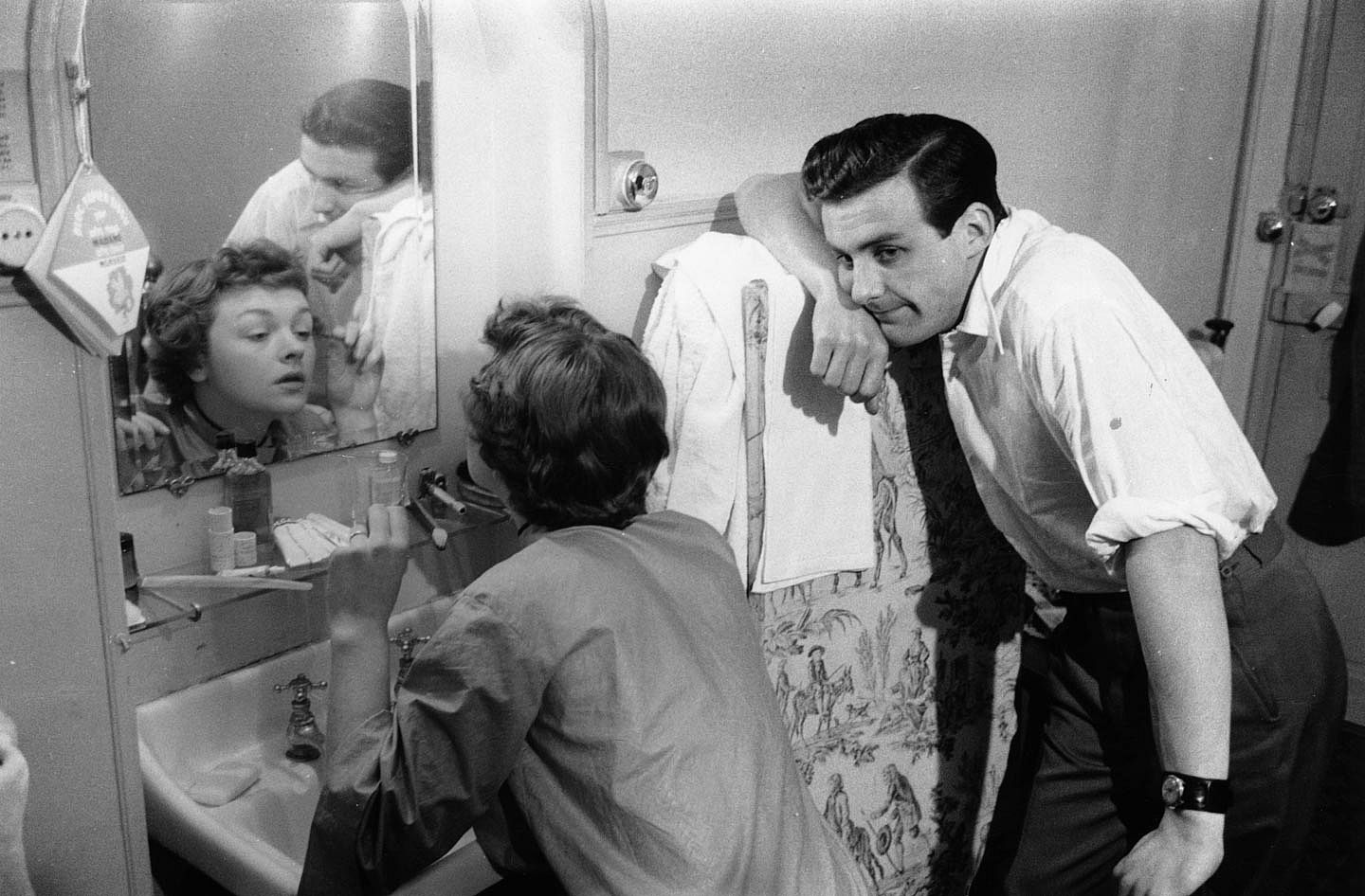Photo of an impatient man waiting on his wife to get ready.
