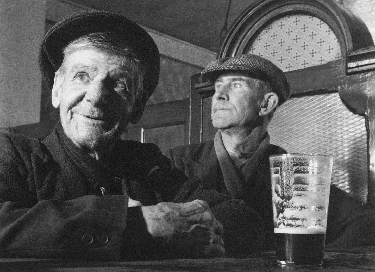 Henry Barter with a pint of Guinness at John Mullet's bar in Amiens Street, Dublin, 22nd August 1953.