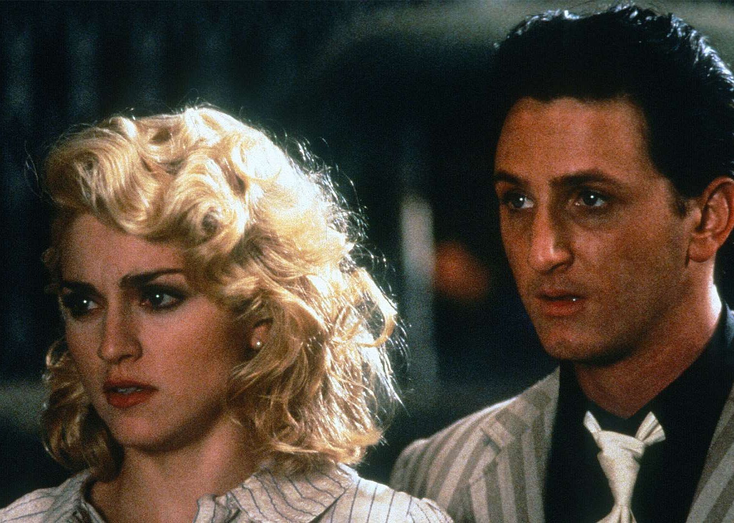 Madonna and Sean Penn with serious looks on their faces.