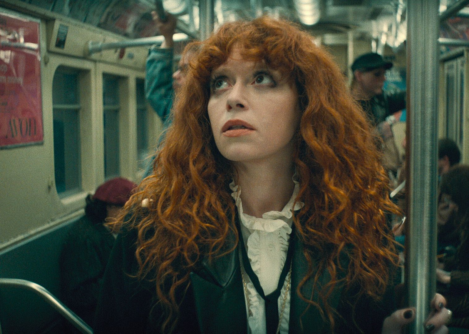 Woman riding a subway.