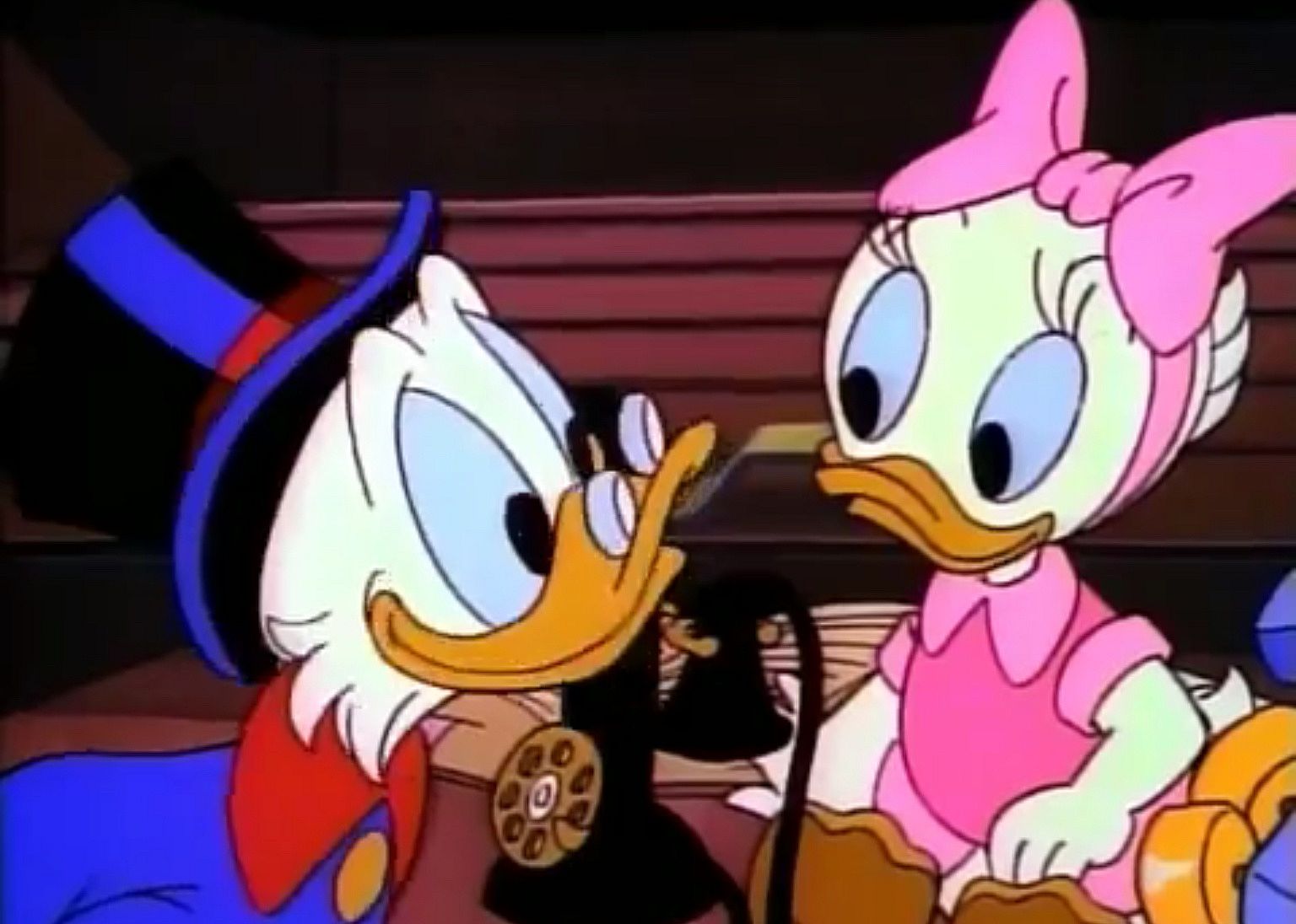 An animation of an old man duck and a little girl duck.