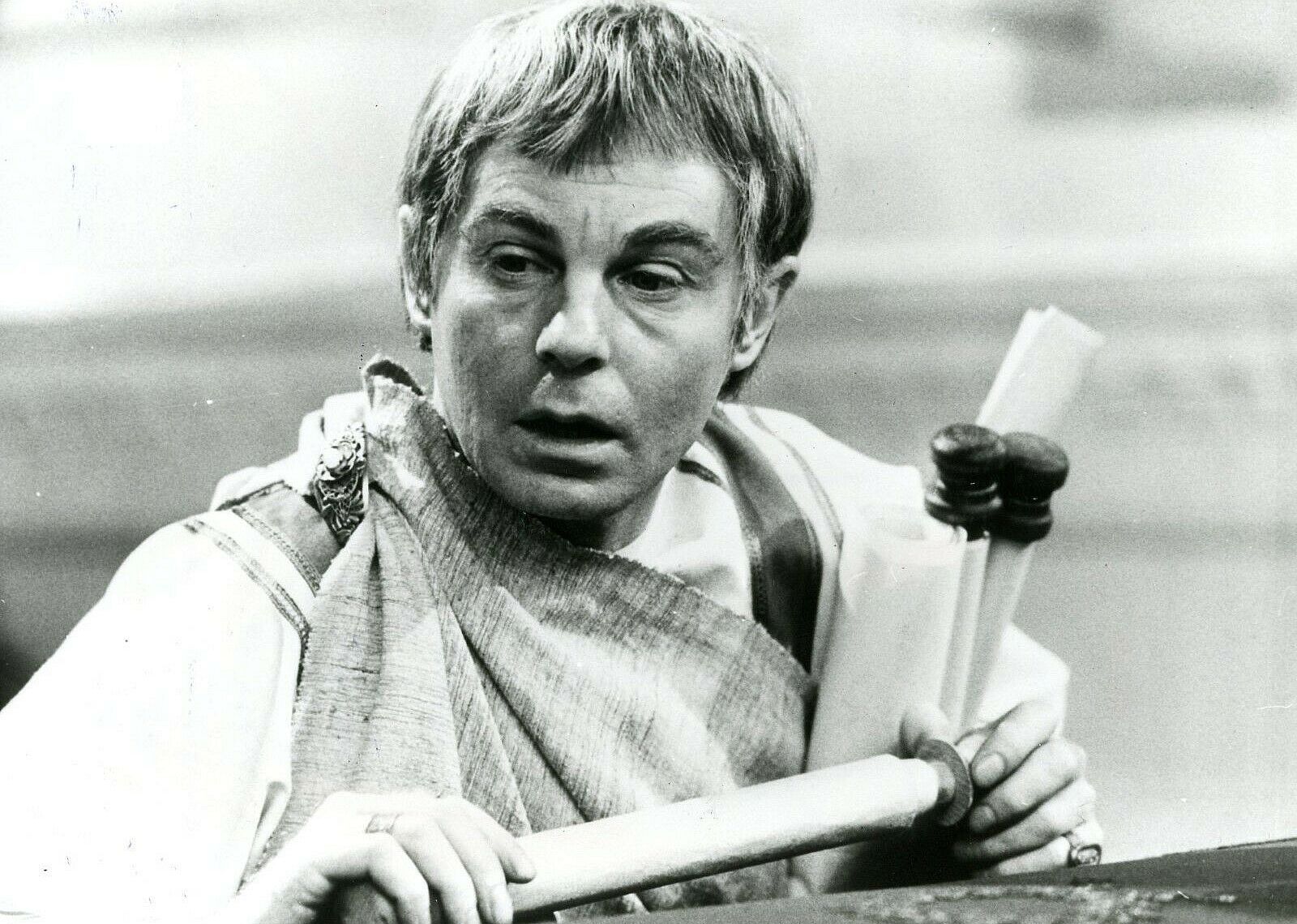 A man holding a scroll.
