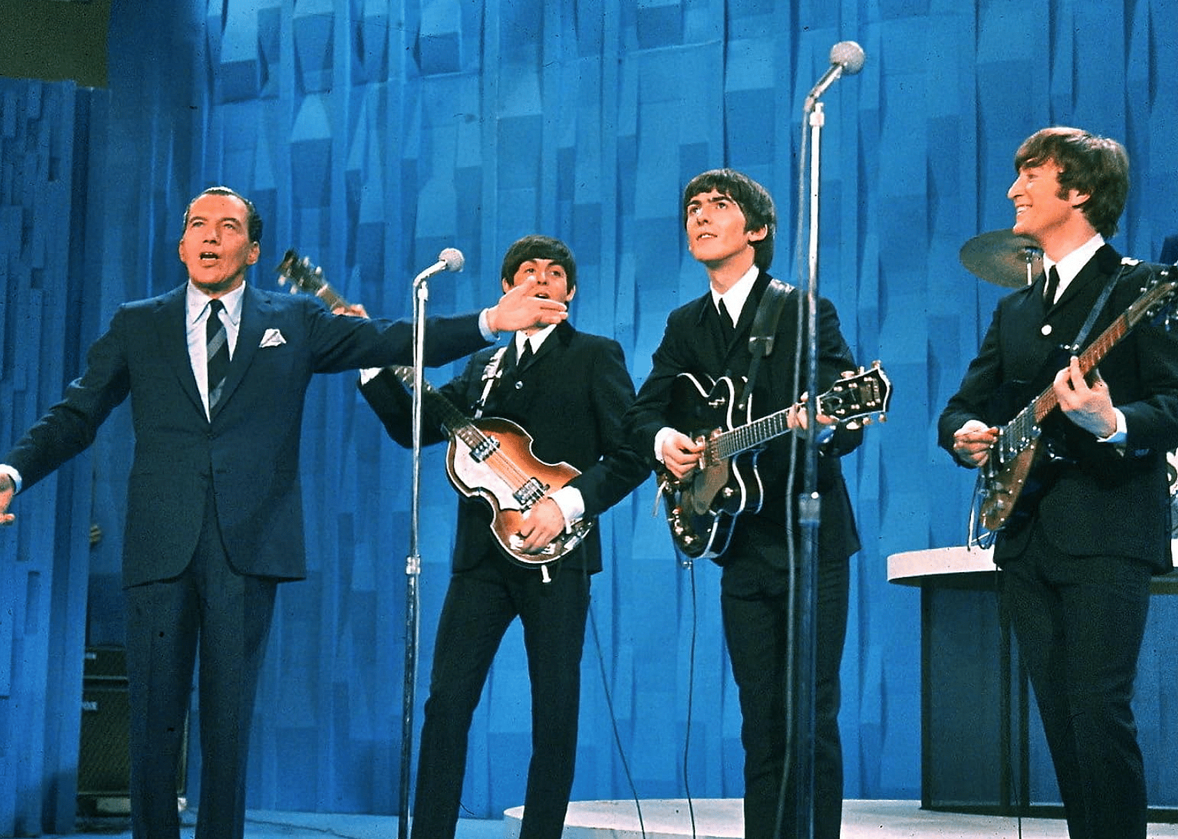 Paul McCartney, John Lennon, George Harrison, Ed Sullivan, and The Beatles in The Ed Sullivan Show.