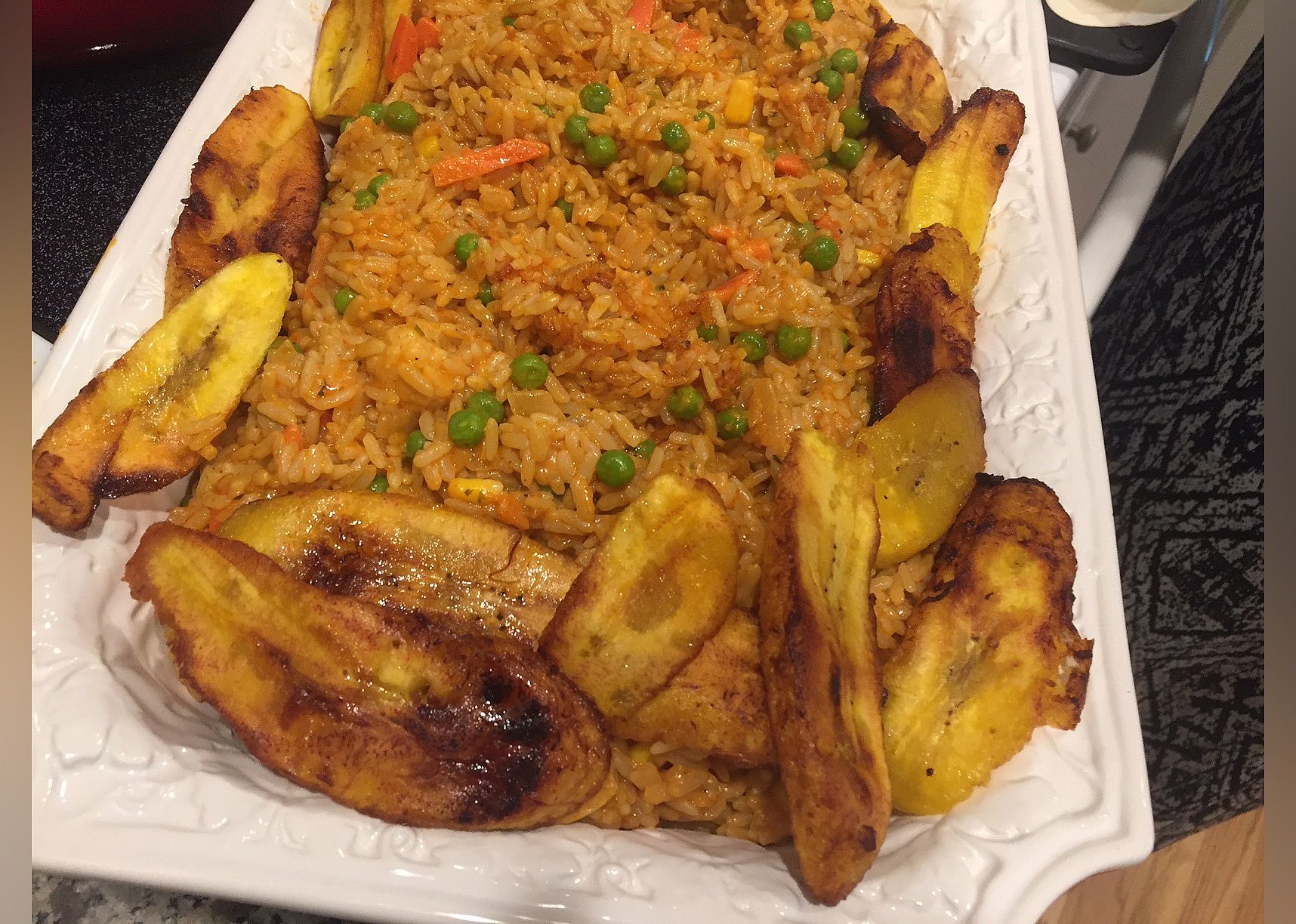 Nigerian Jollof Rice with Chicken and Fried Plantains