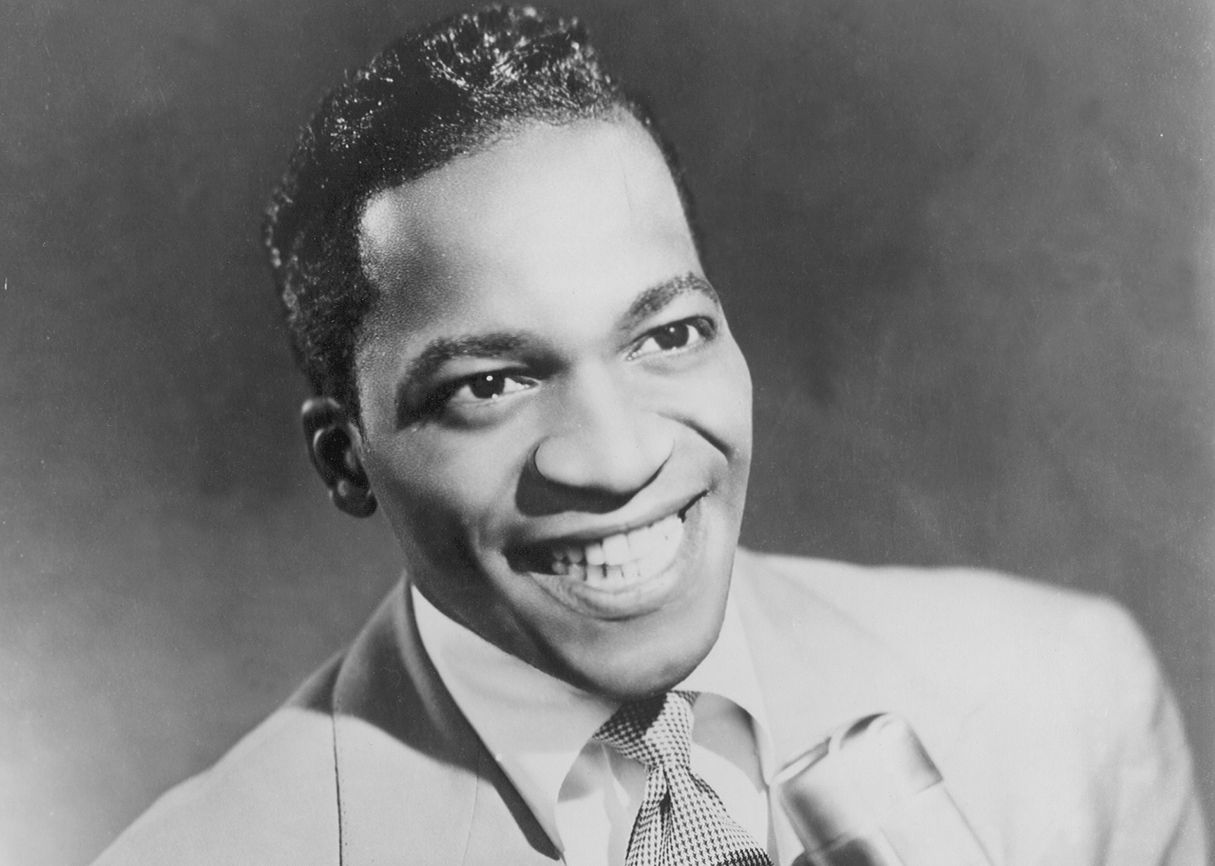Bobby Lewis posed with a microphone
