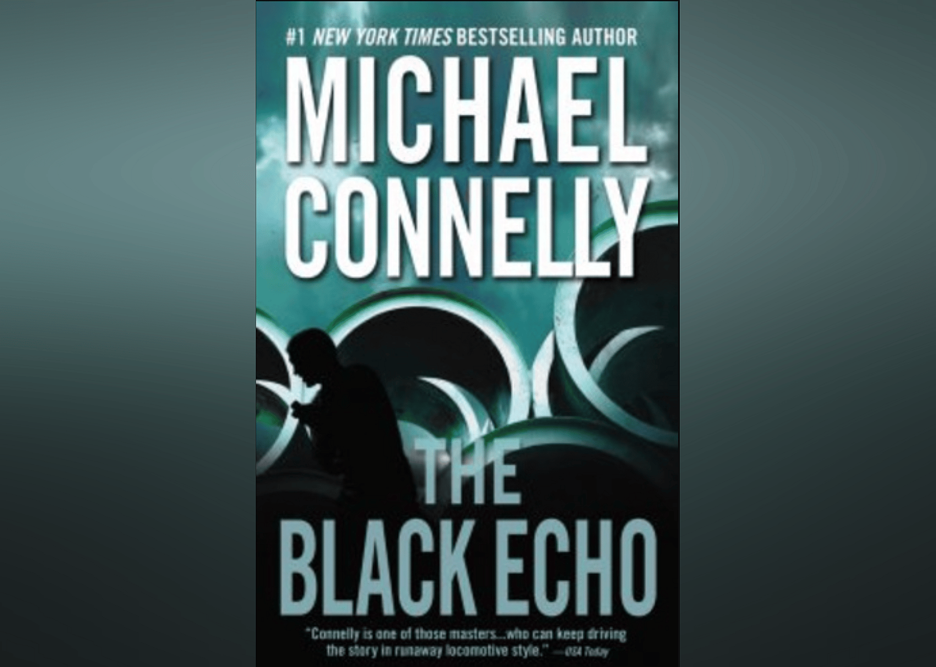 The cover features a silhouette of a man in front of a stack of large circular structures.