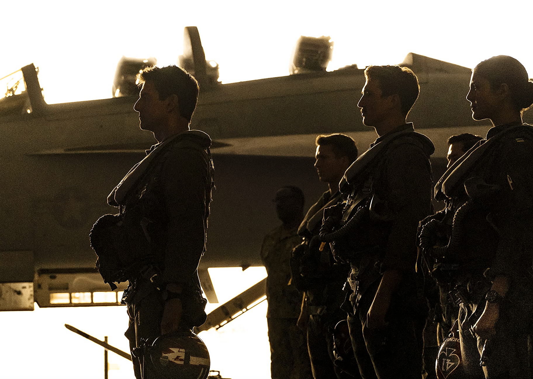 Tom Cruise, Glen Powell, Miles Teller, and Monica Barbaro in "Top Gun: Maverick".