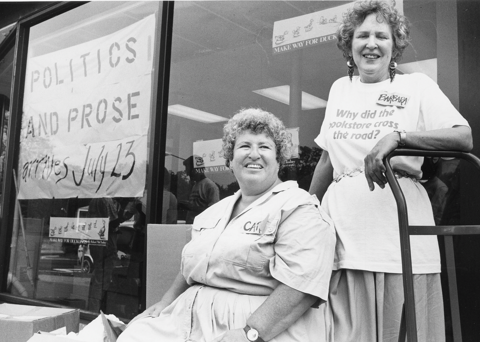 Carla Cohen and Barbara Meade in front of their bookstore