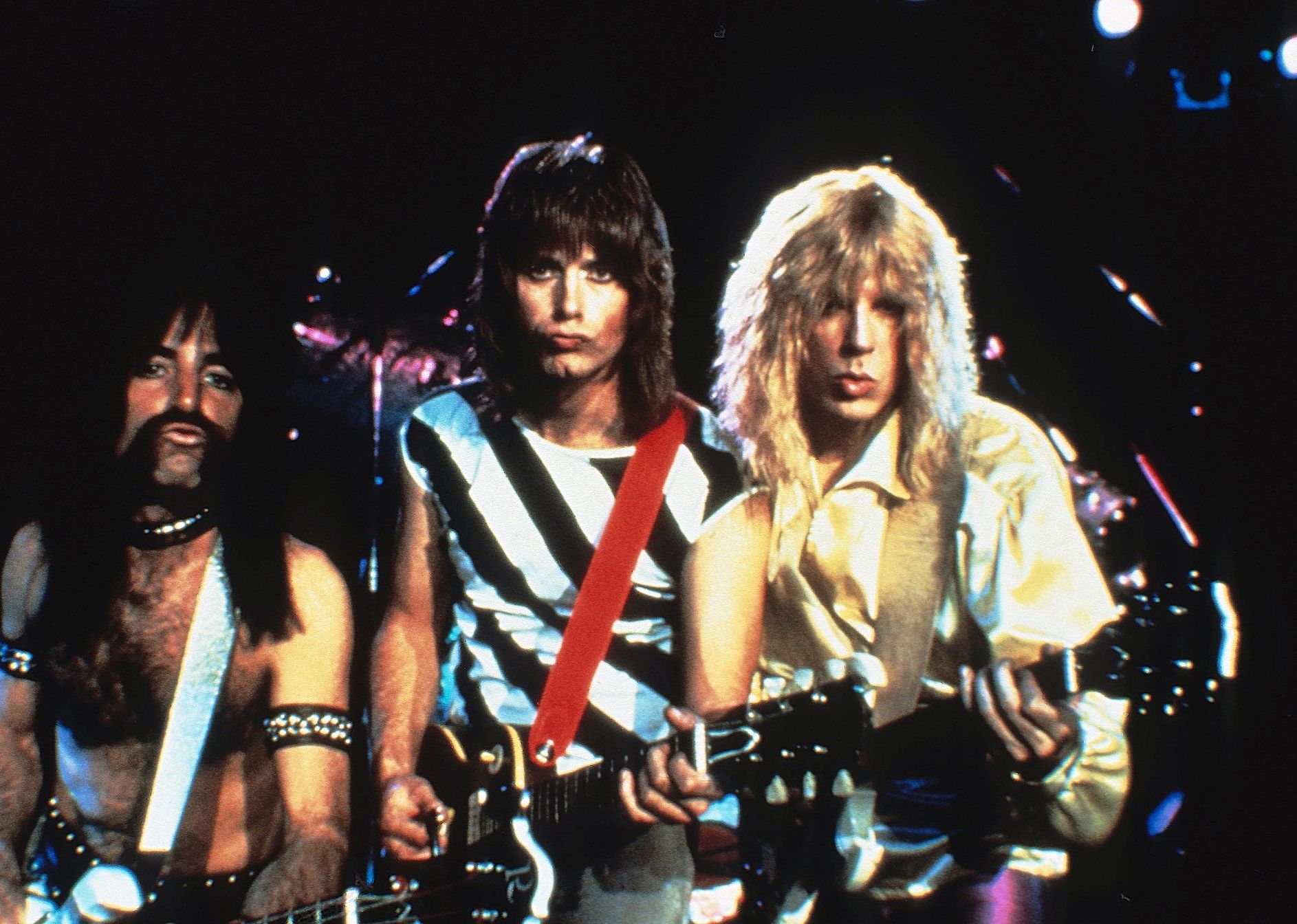 A hair band poses making faces for the camera.