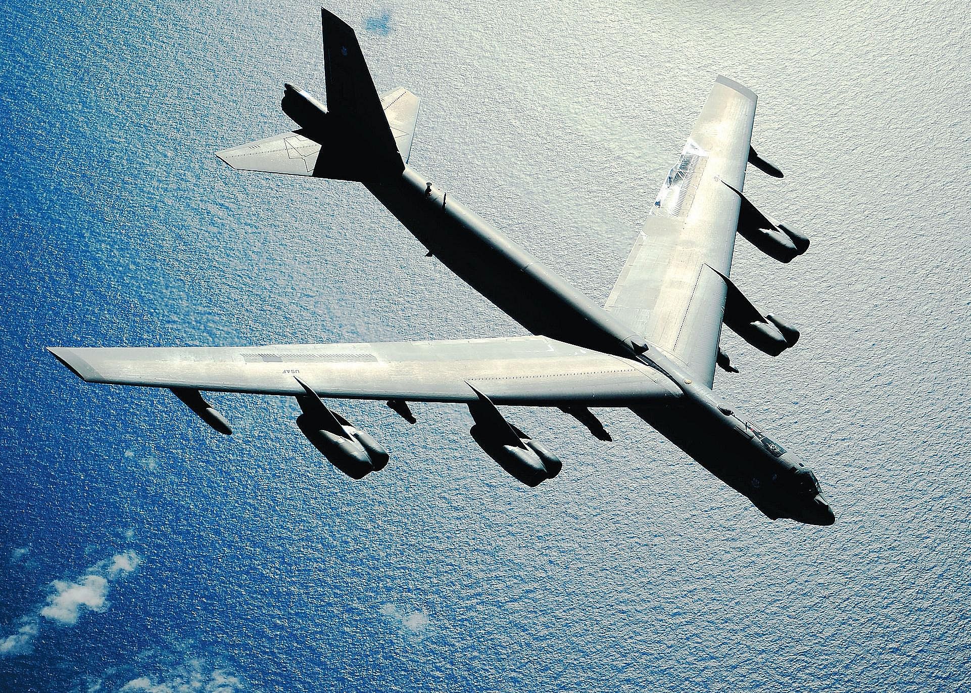 Pictured: A B-52 Stratofortress flies over the Pacific Ocean after an air refueling in support of exercise Rim of the Pacific