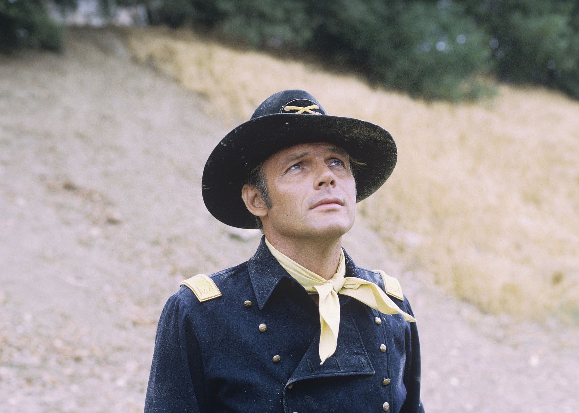 A man in a military uniform and hat.