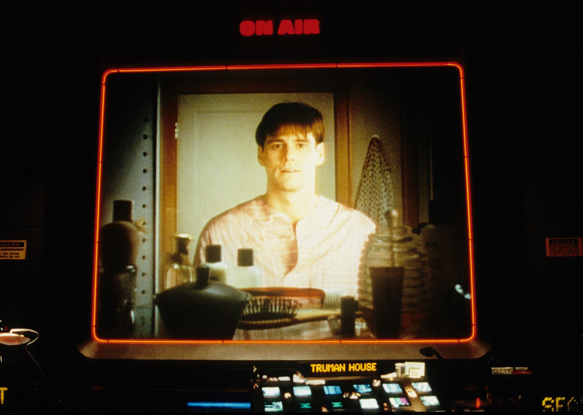 Jim Carrey through a tv screen that says On Air.