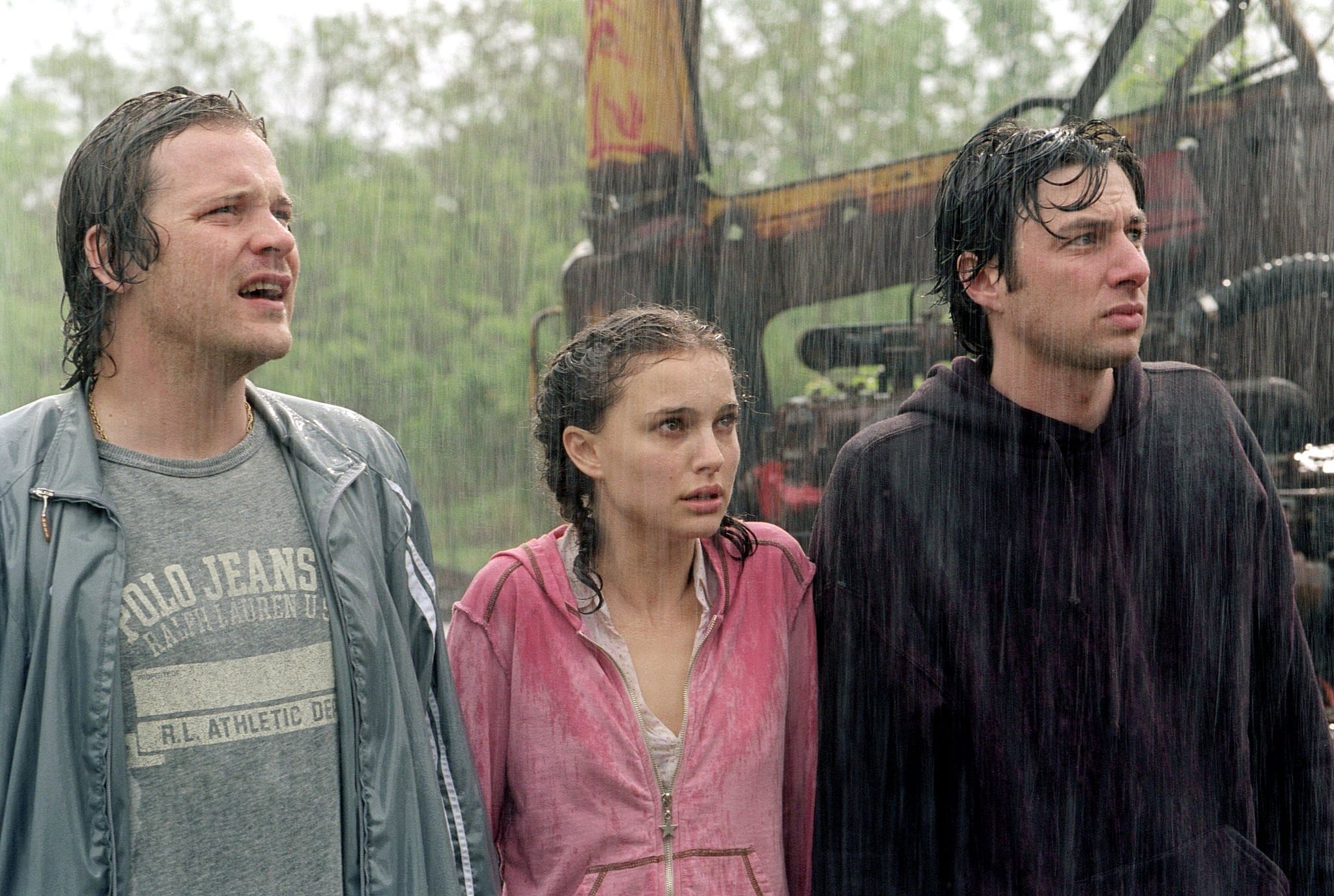 Natalie Portman, Zach Braff, and Peter Sarsgaard standing in the rain.