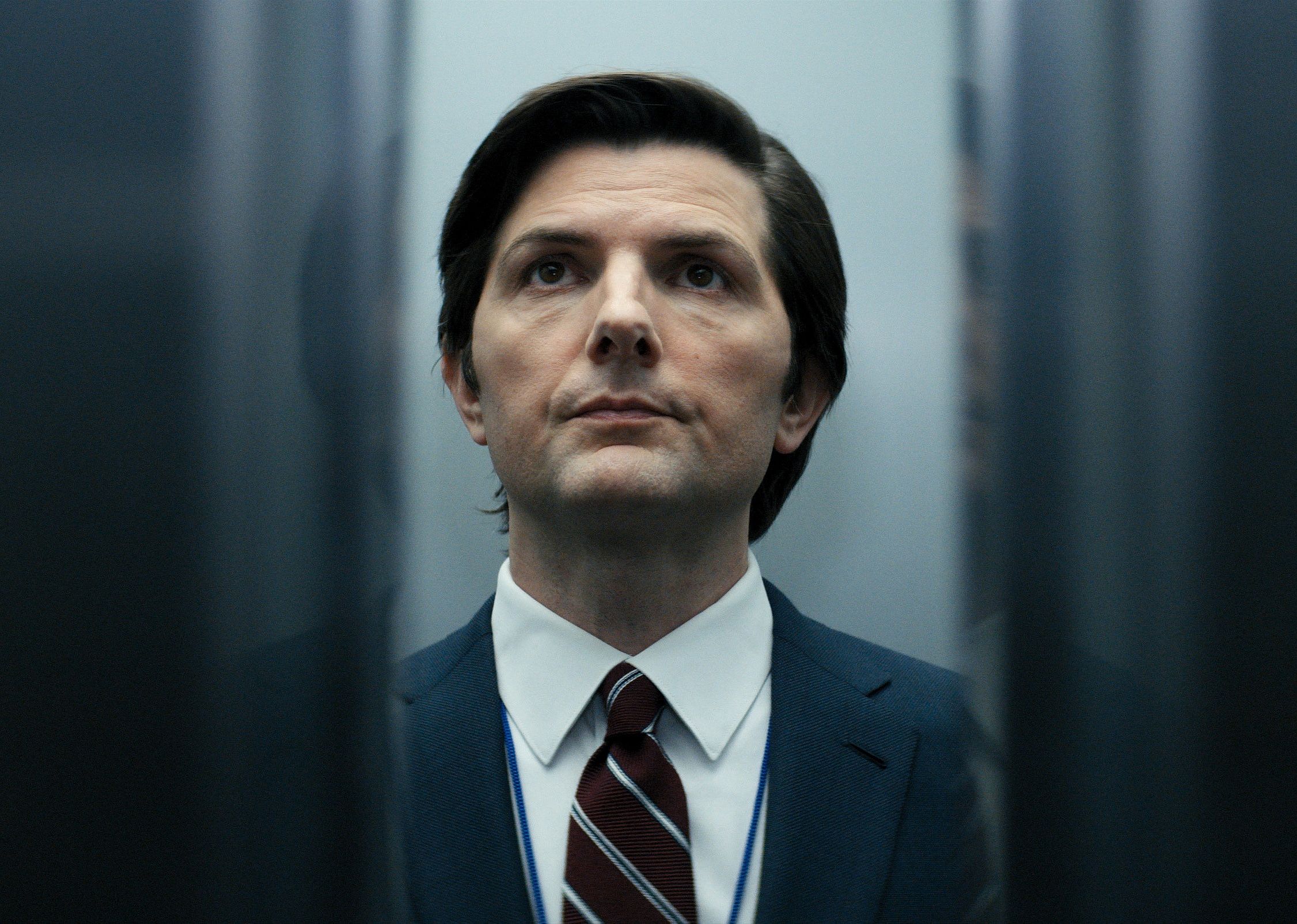 Adam Scott in an elevator.