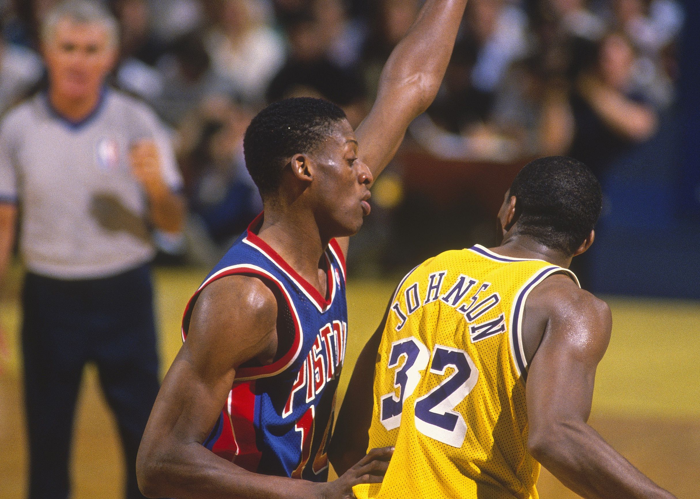 Dennis Rodman guards against the Lakers' Magic Johnson