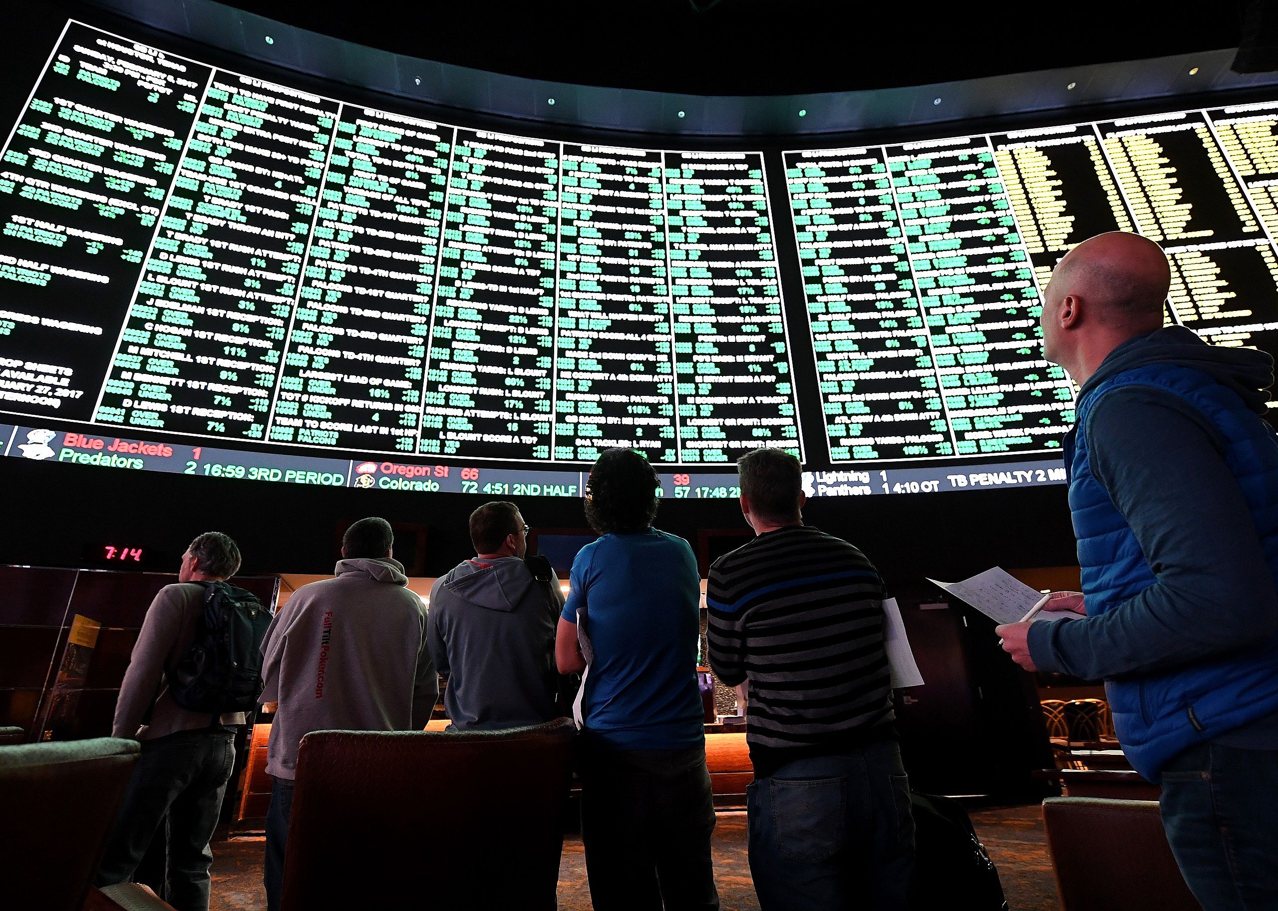 Bettors line up to place wagers