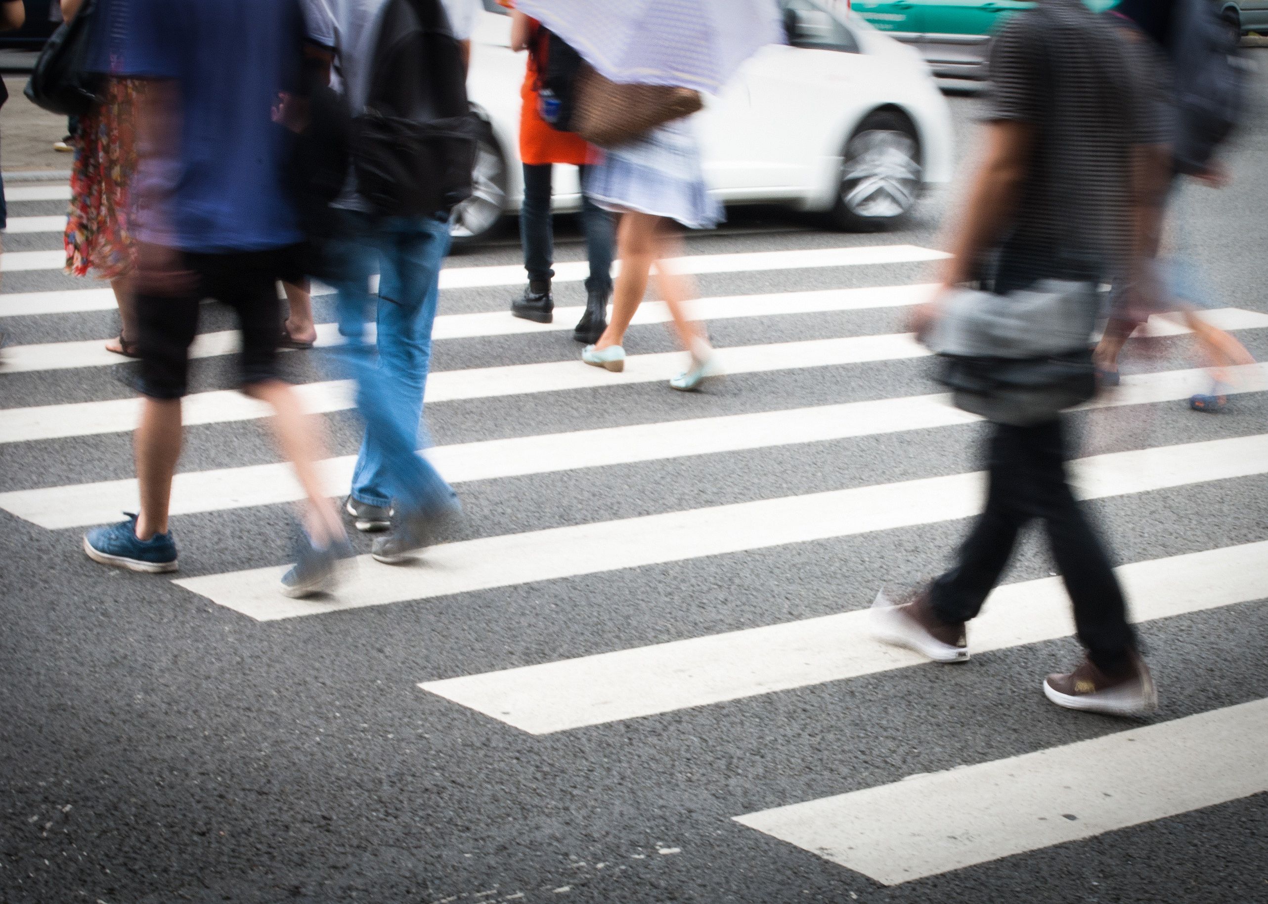 Busy city street with people on crosswalk
