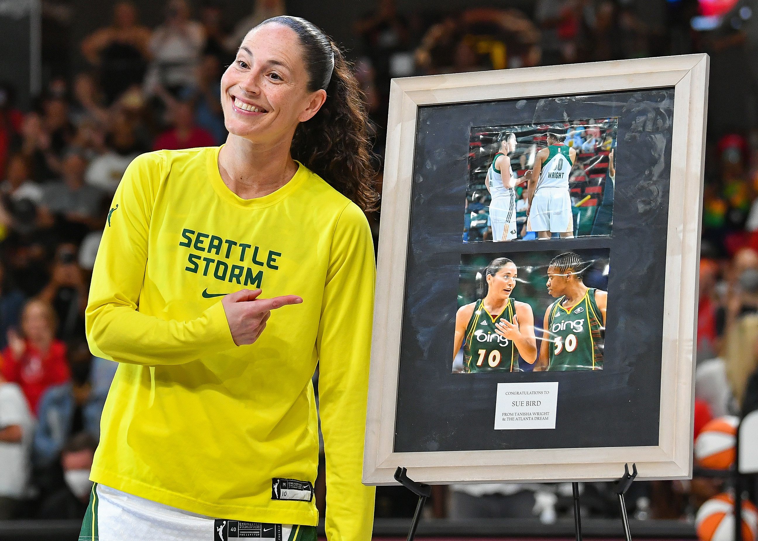 Sue Bird reacts after receiving retirement gifts