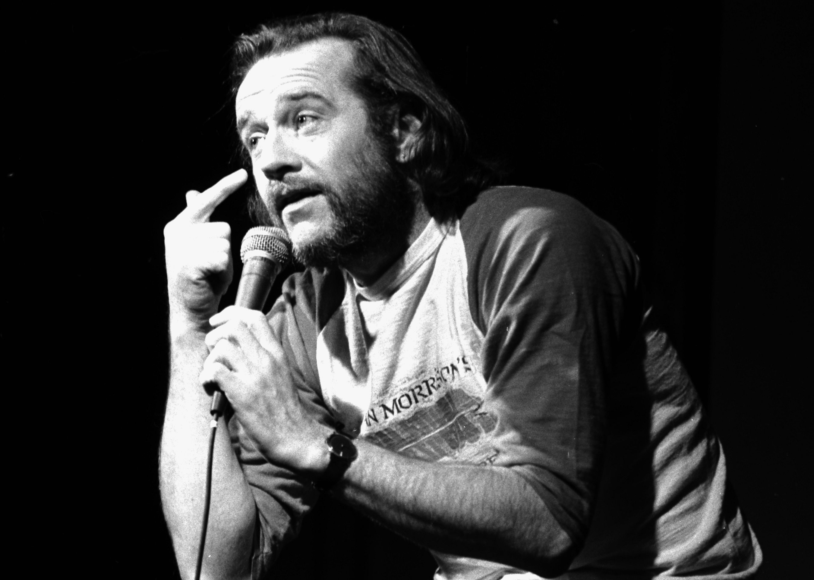 George Carlin onstage.