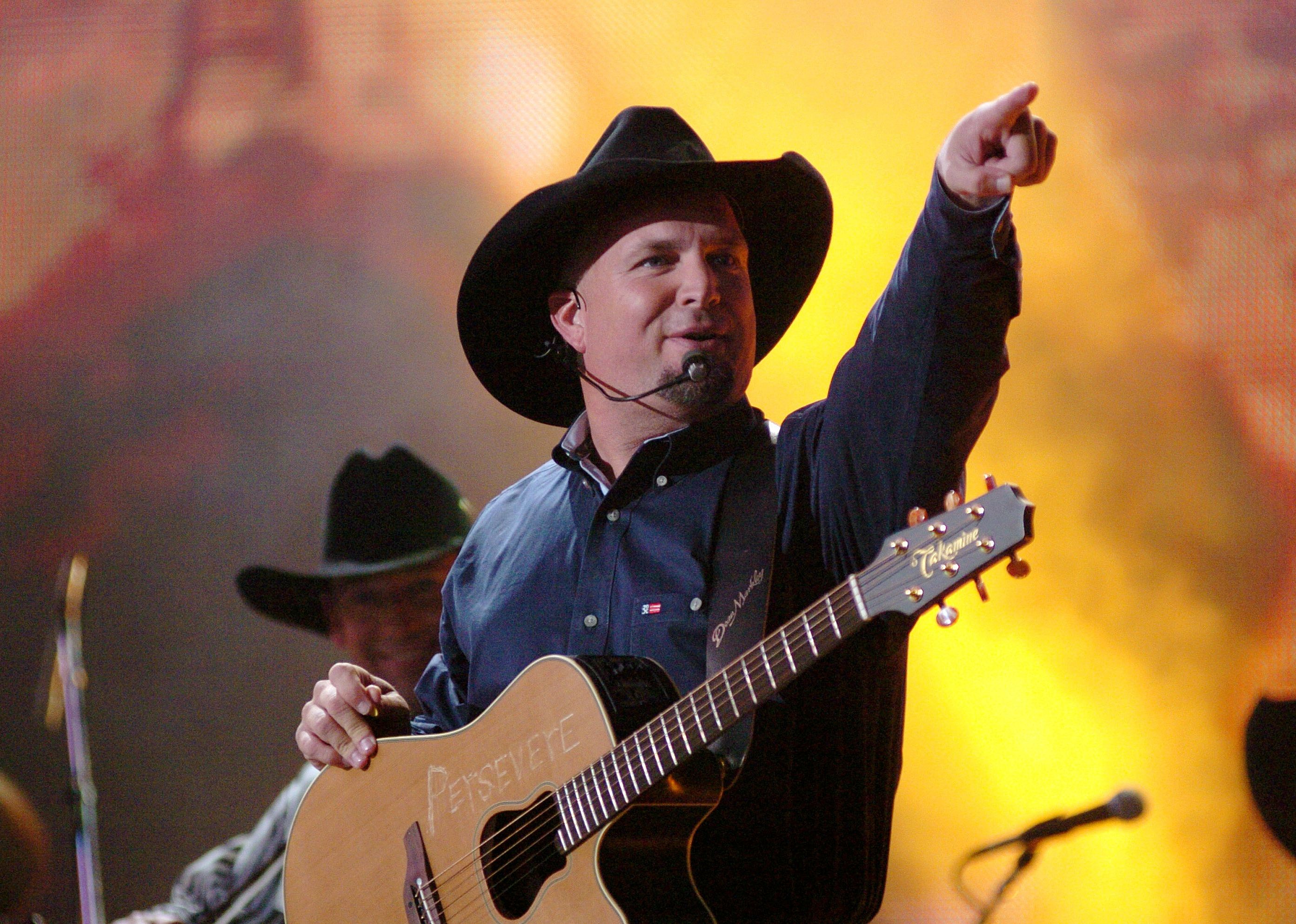 Garth Brooks performs "Good Ride Cowboy" during The 39th Annual CMA Awards.