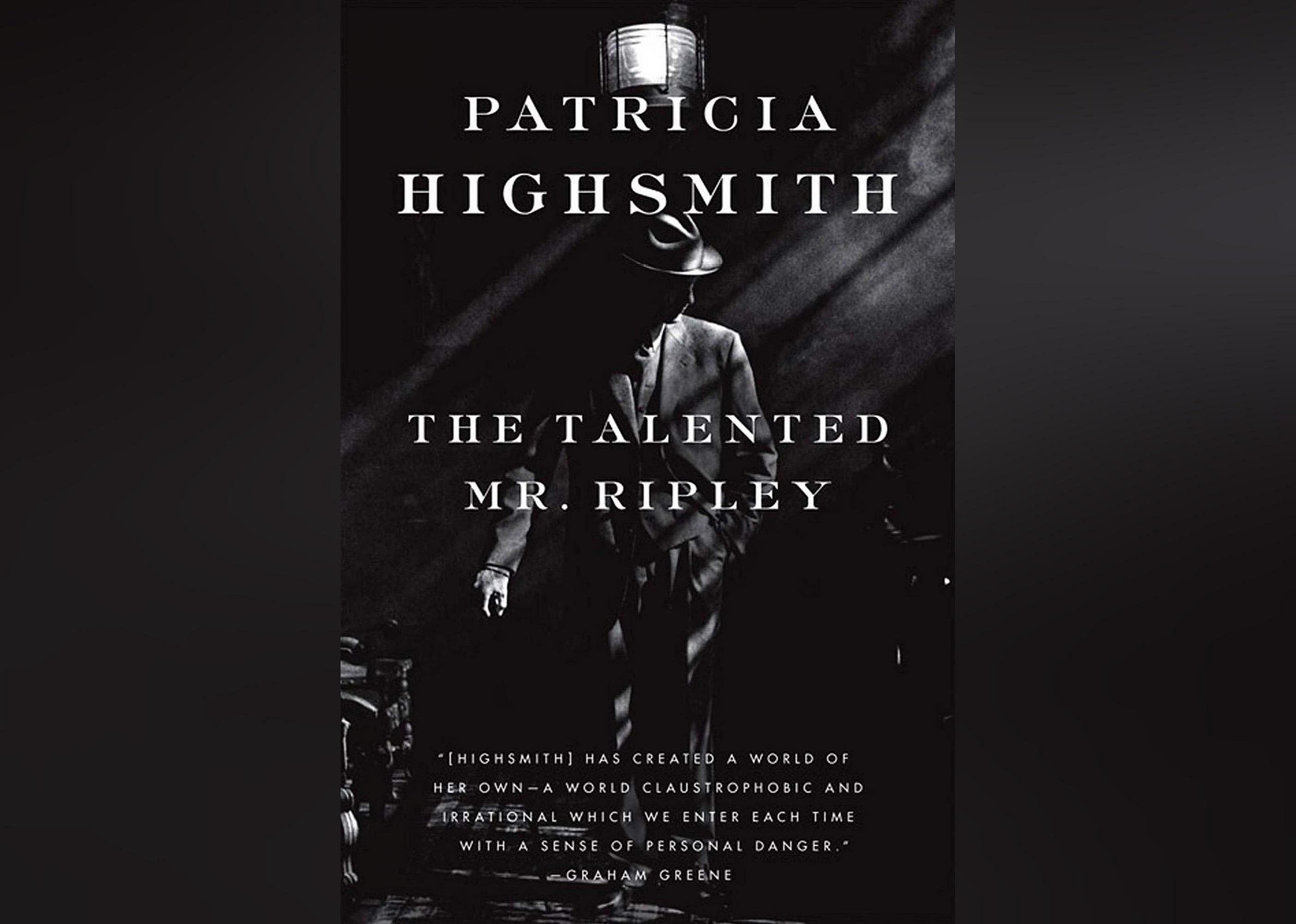 The cover shows a man in a suit and hat, standing in a dark room with shadows cast upon him. 