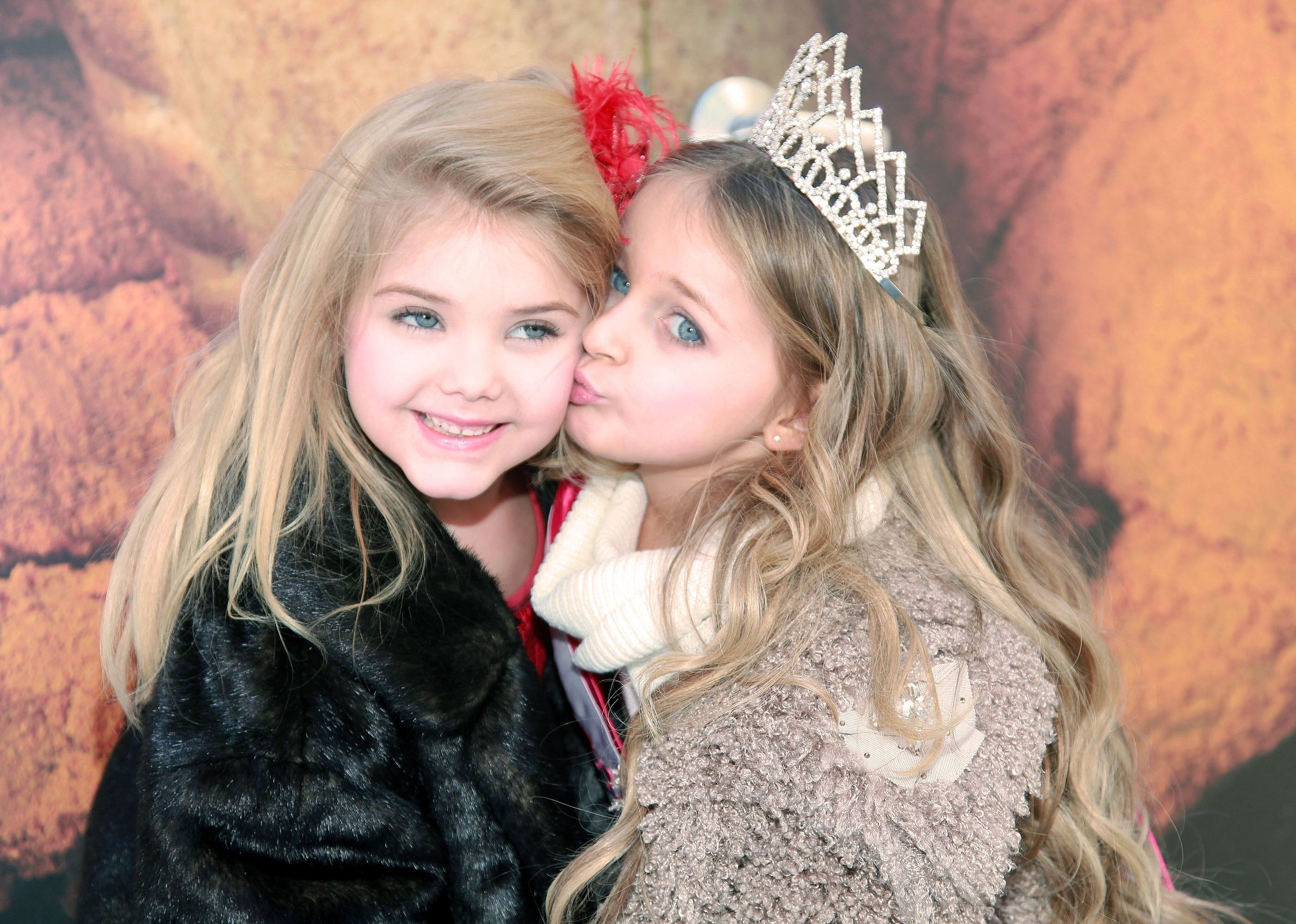 Two girls from the show pose together in makeup.