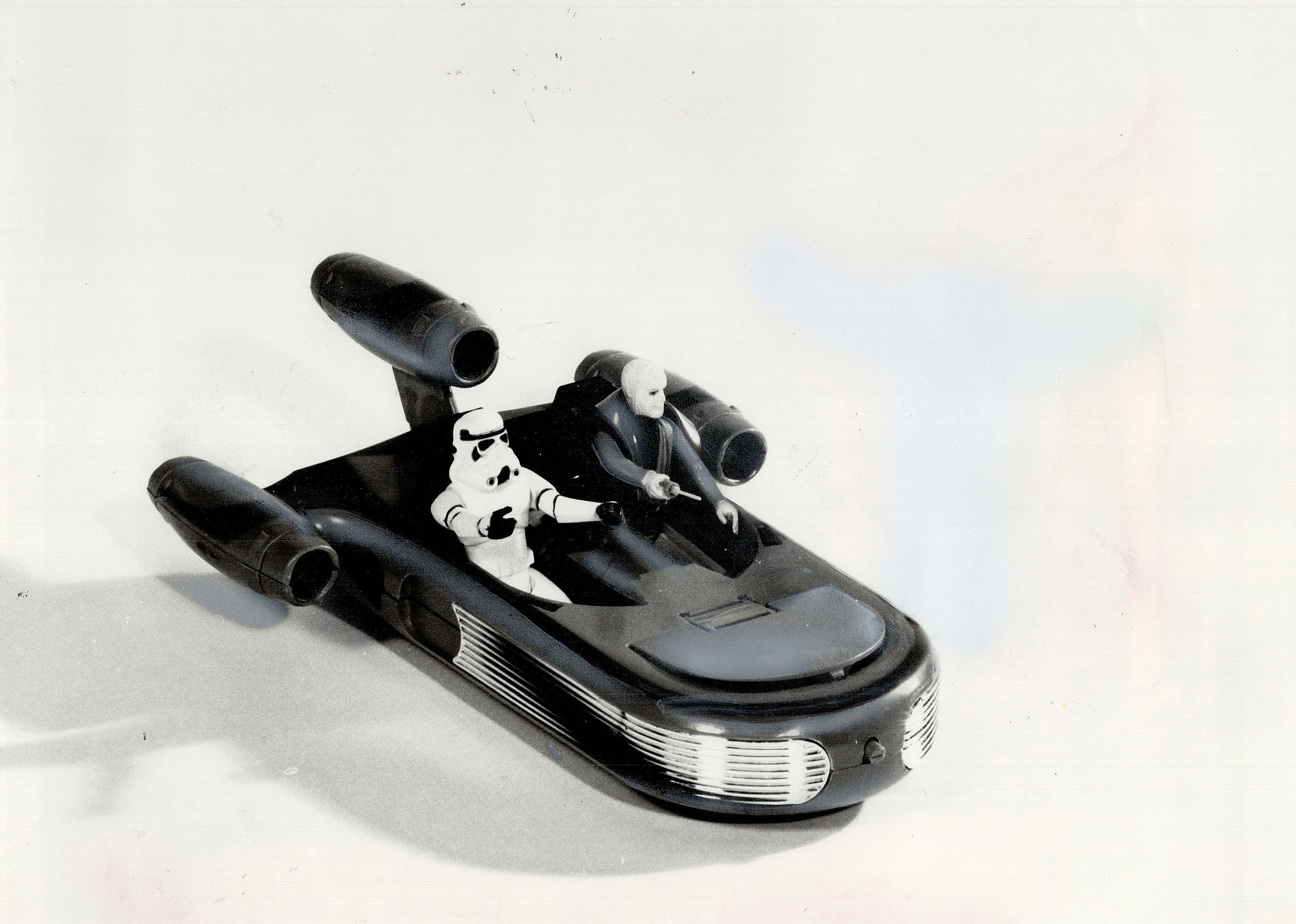 A plastic Star Wars toy on a white background.