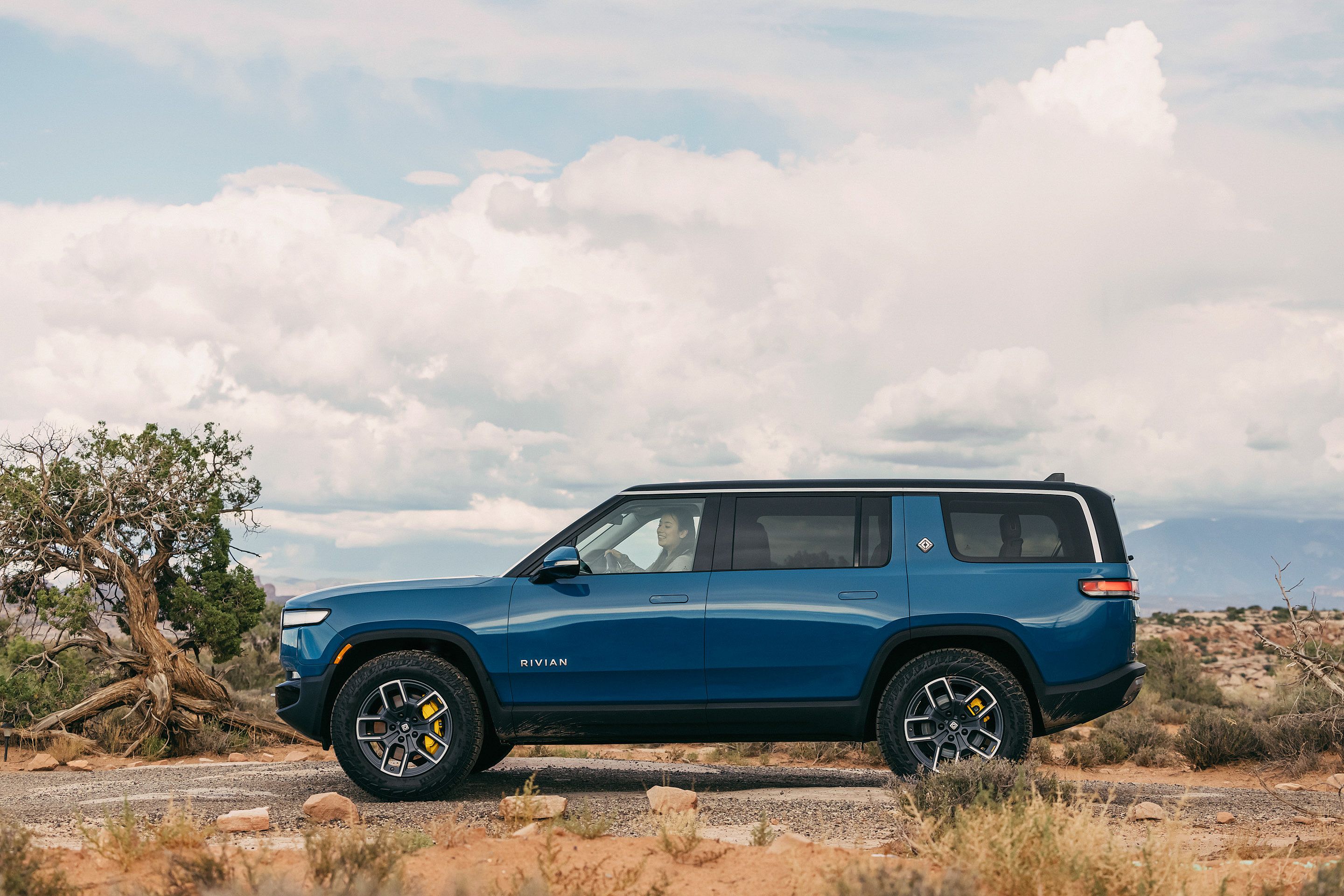 blue Rivian R1S in the desert
