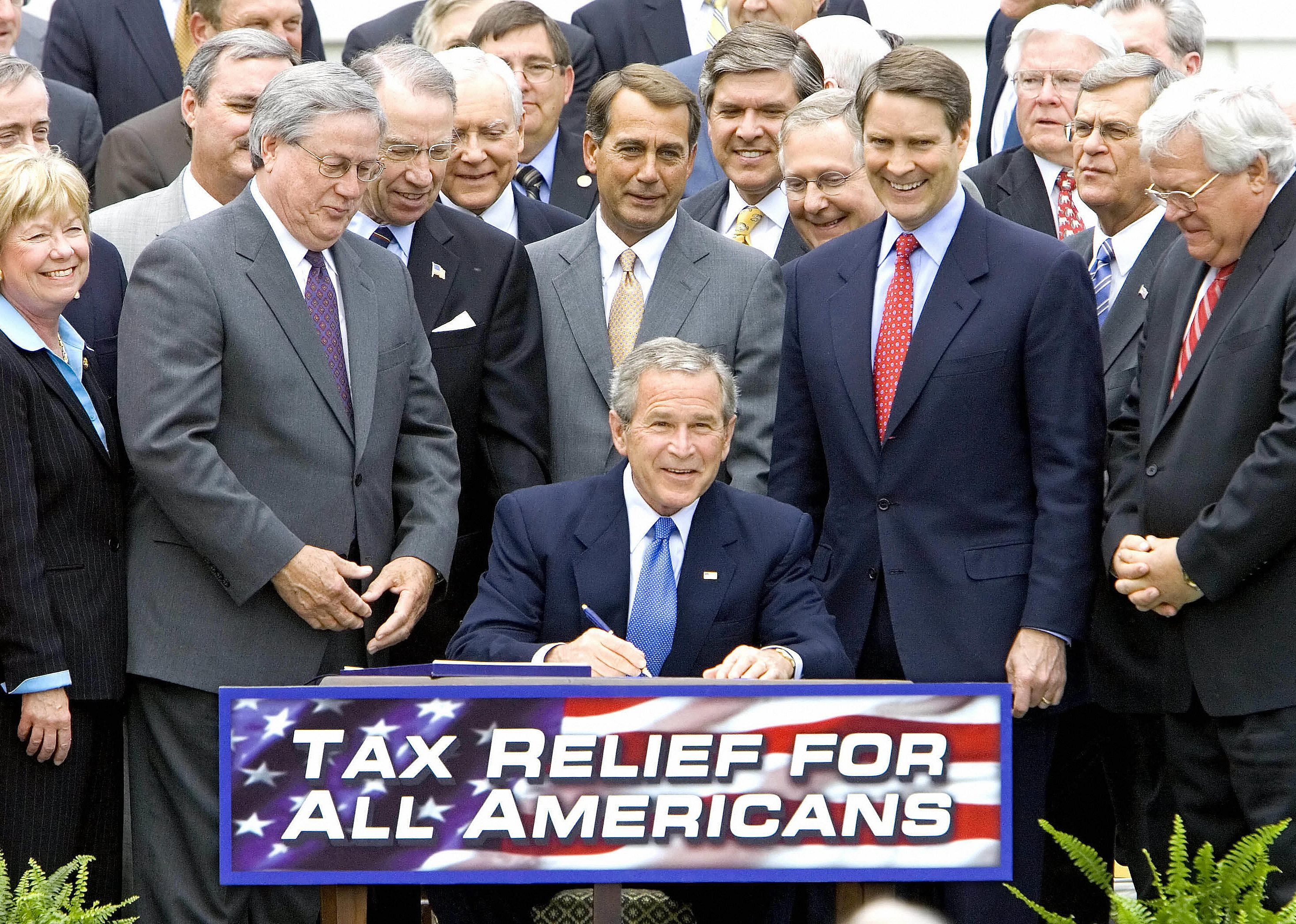 George W. Bush twice cuts taxes, benefiting the rich