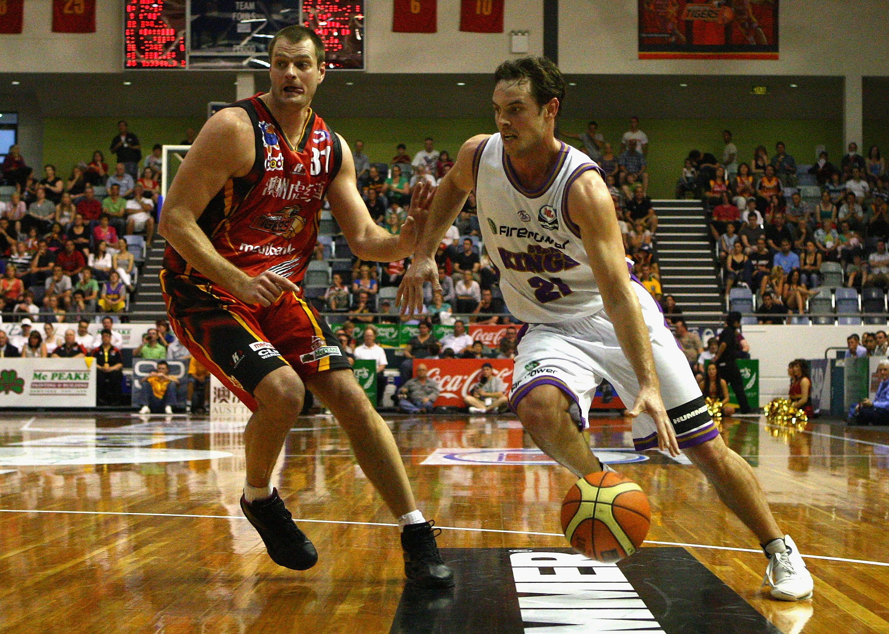 Martin Muursepp puts pressure on an opposing player during a game.