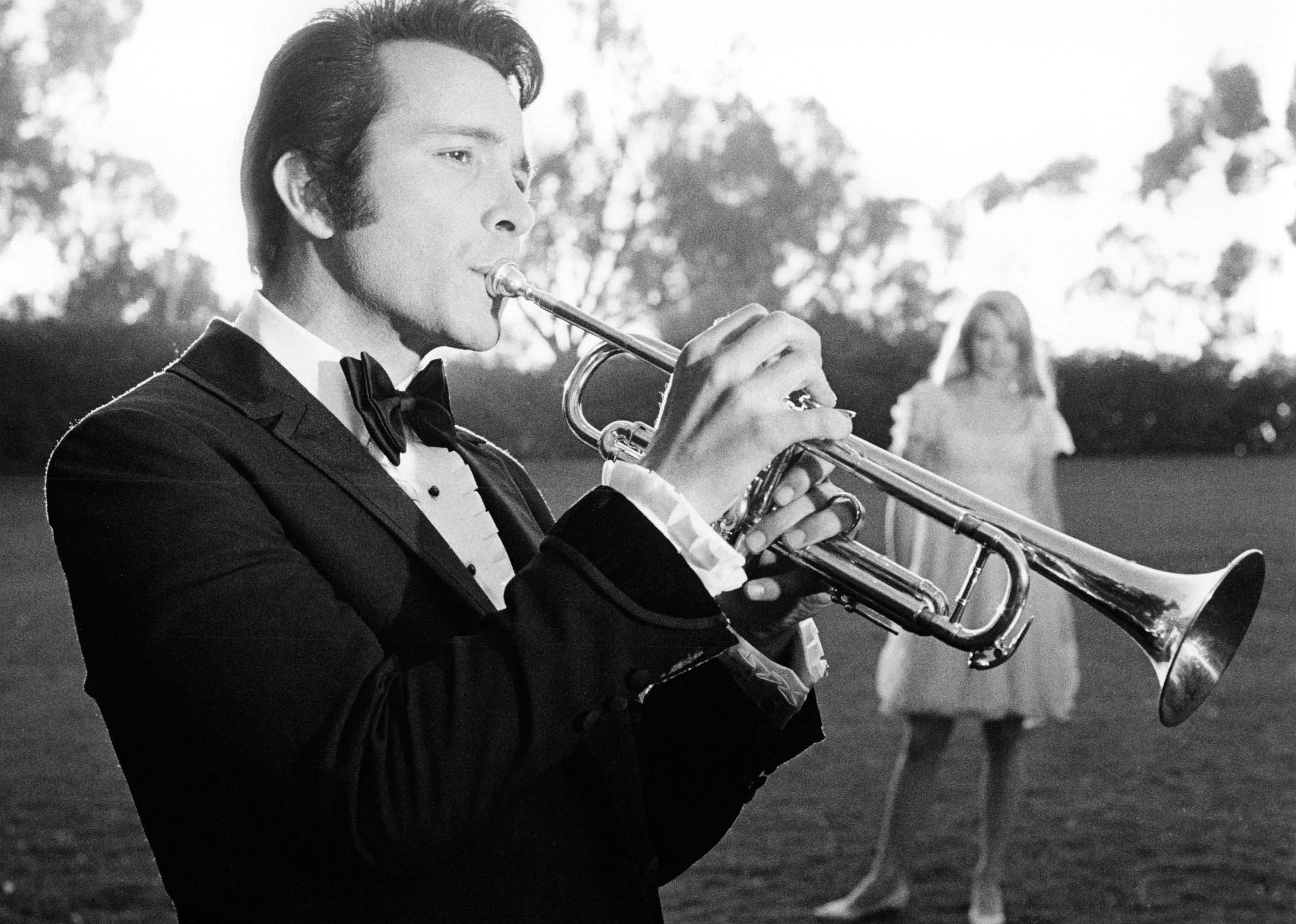 American musician Herb Alpert playing a trumpet,