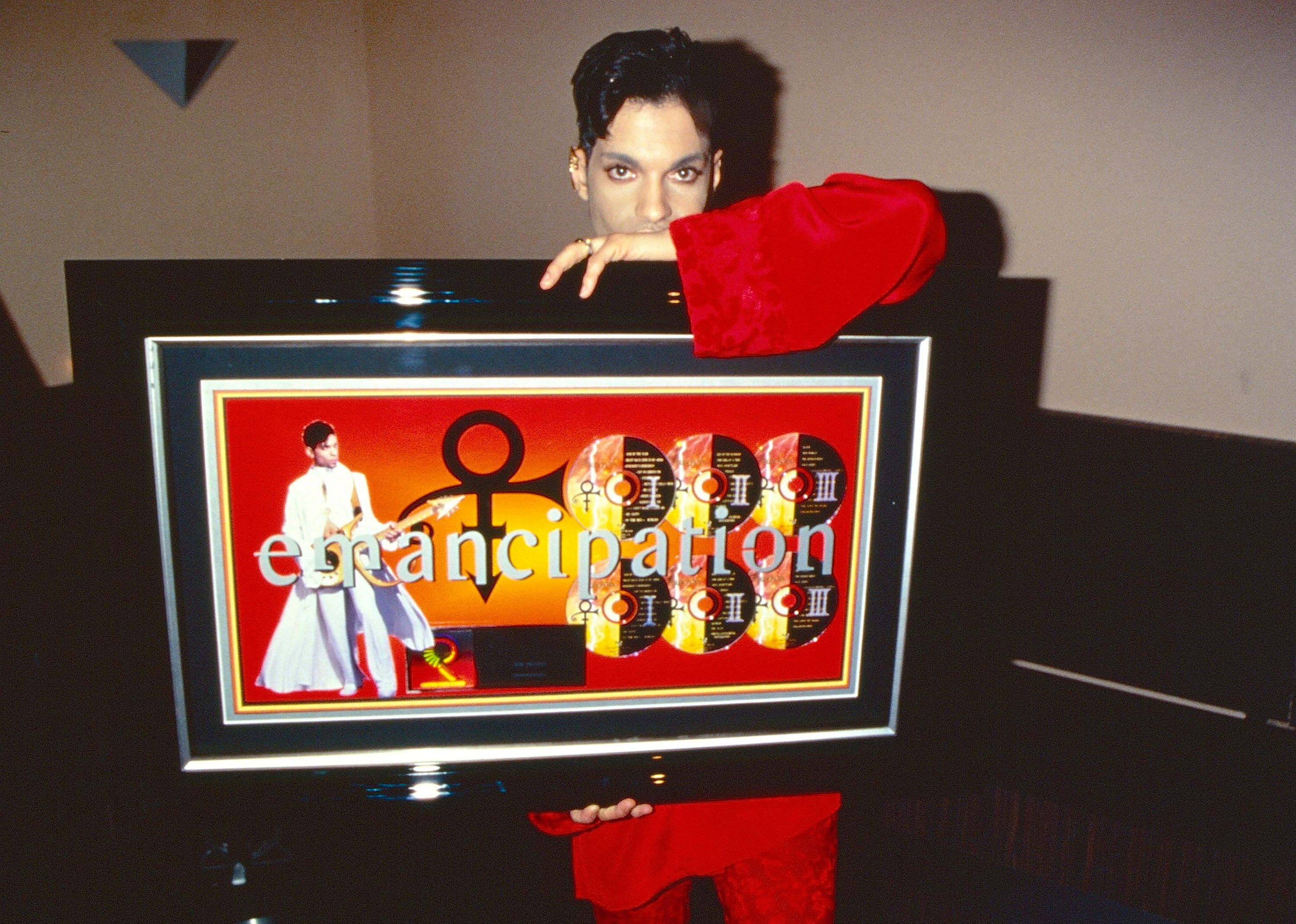 Prince poses during his "Emancipation" album release party.