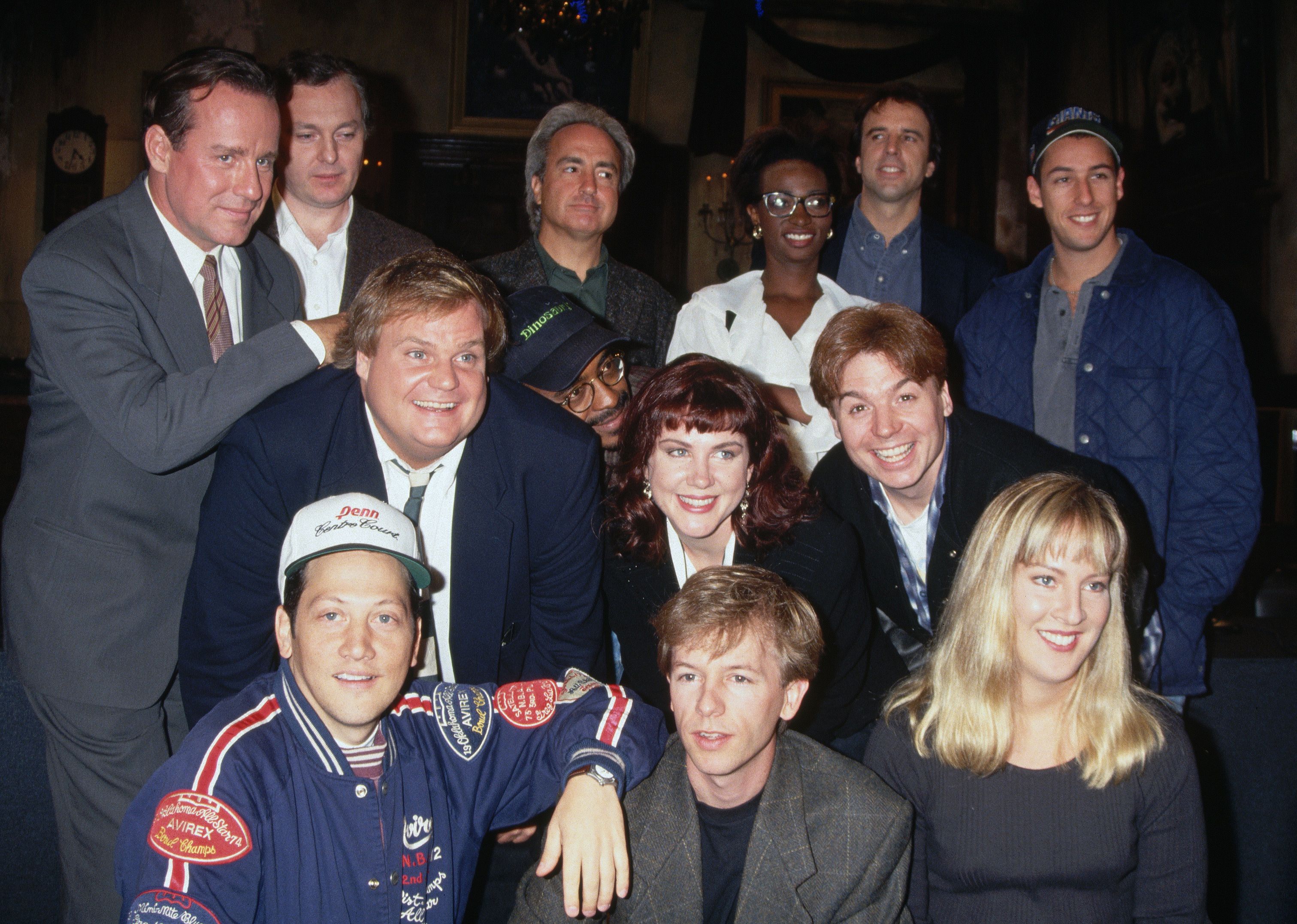Phil Hartman, Lorne Michaels, Ellen Kleghorne, Kevin Nealon, Adam Sandler, Chris Farley, Tim Meadows, Mike Myers, Rob Schneider and David Spade posing.