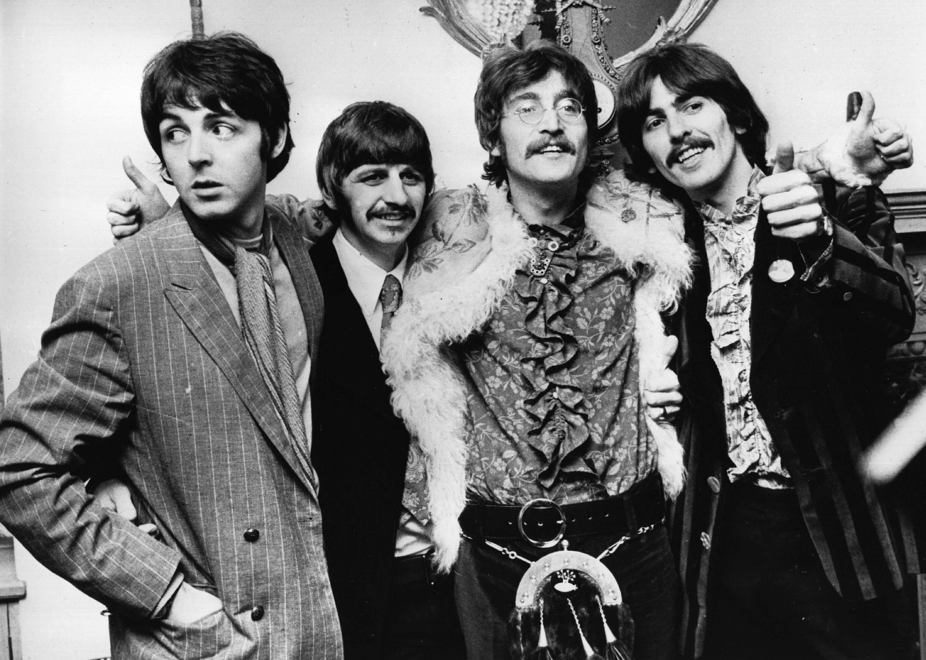  The Beatles celebrate the completion of their new album, 'Sgt Pepper's Lonely Hearts Club Band'.