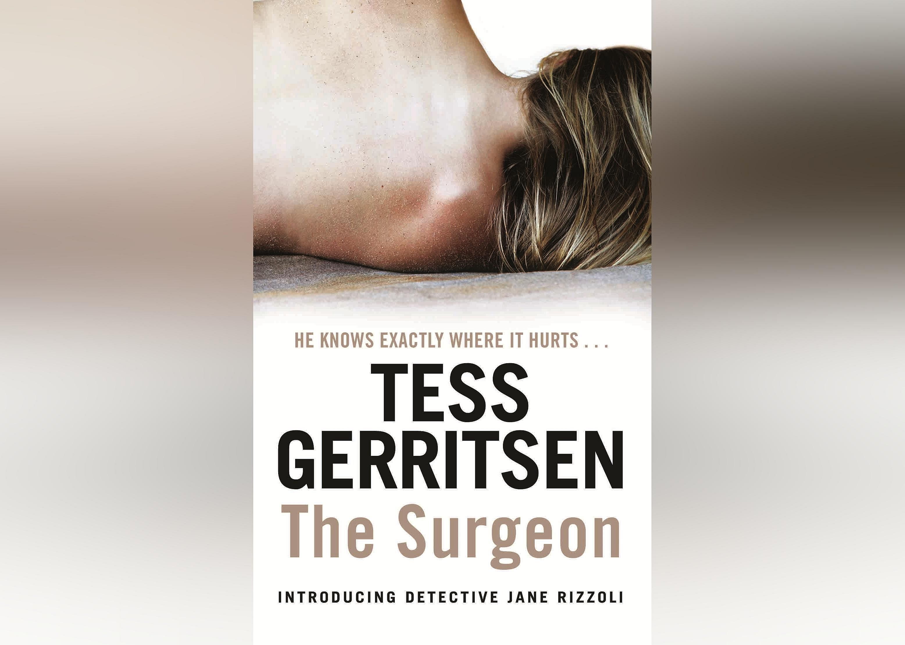 The cover features the back of a shirtless woman laying on her side. 