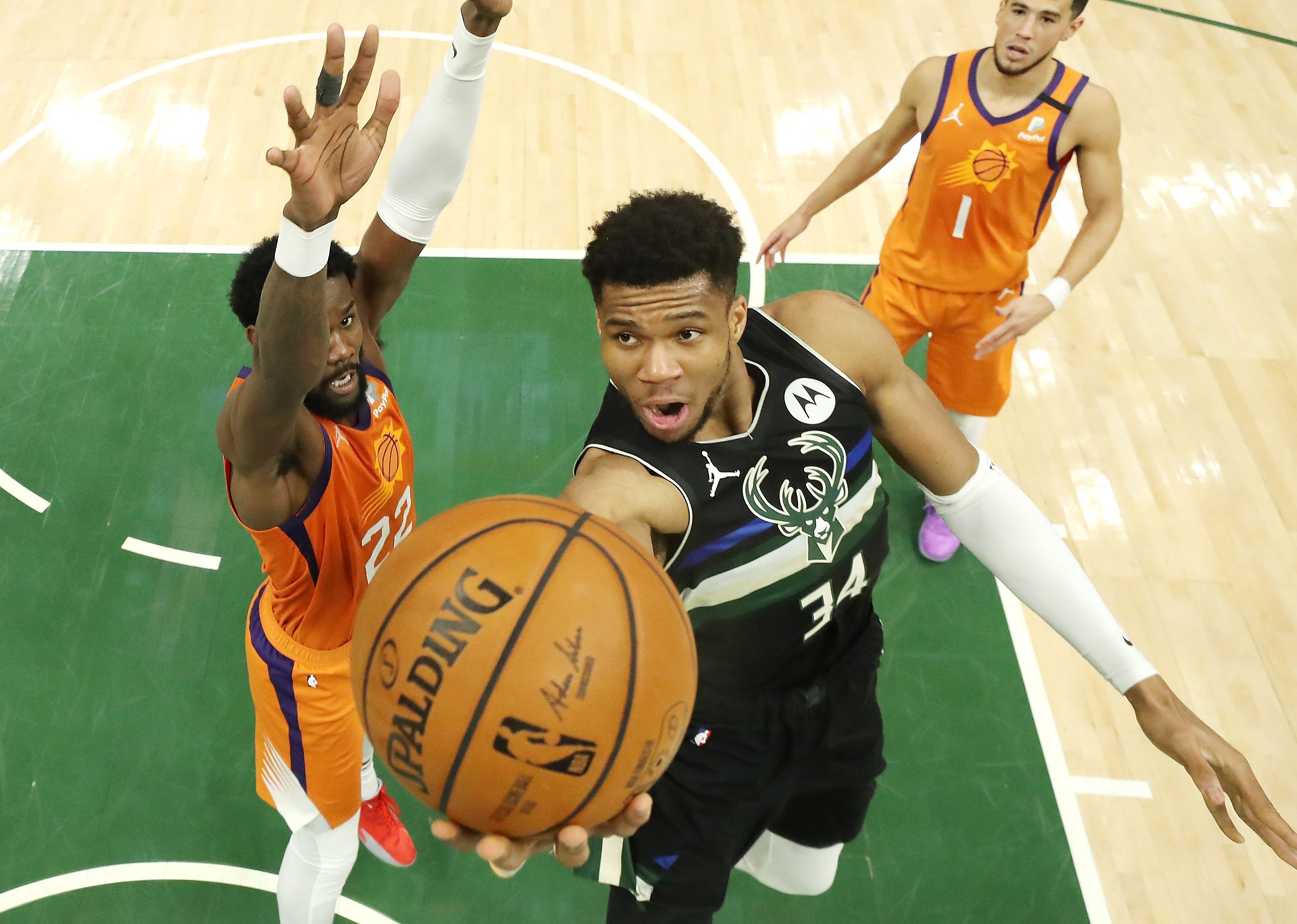 Giannis Antetokounmpo goes up for a shot