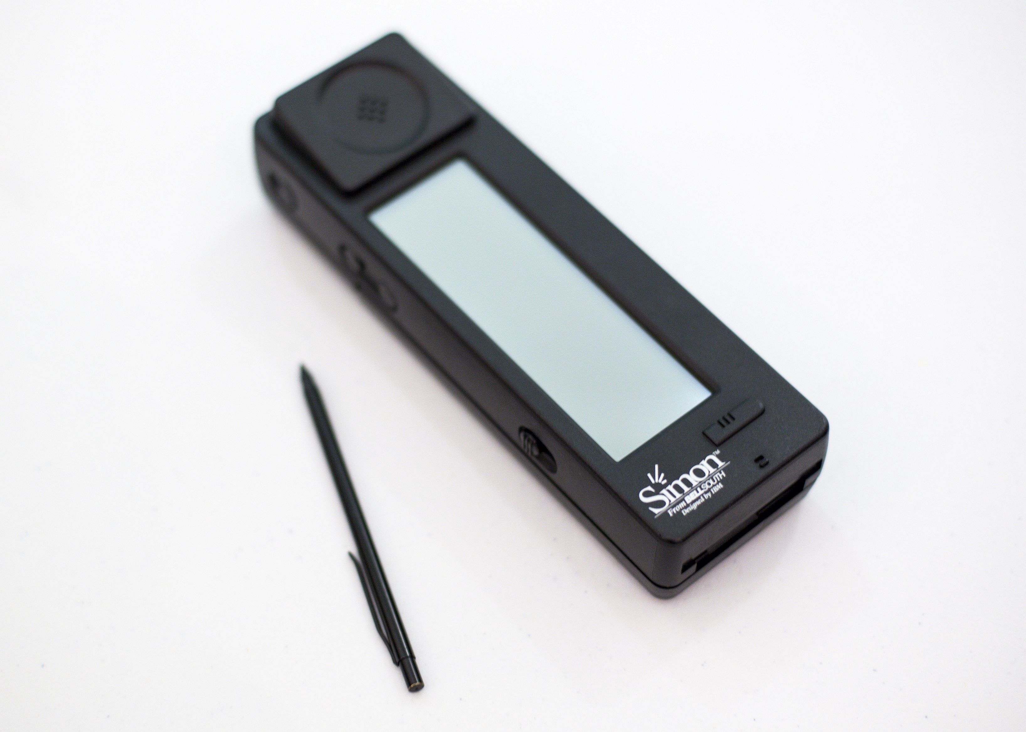 A long rectangular black phone with a skinny screen in the middle.