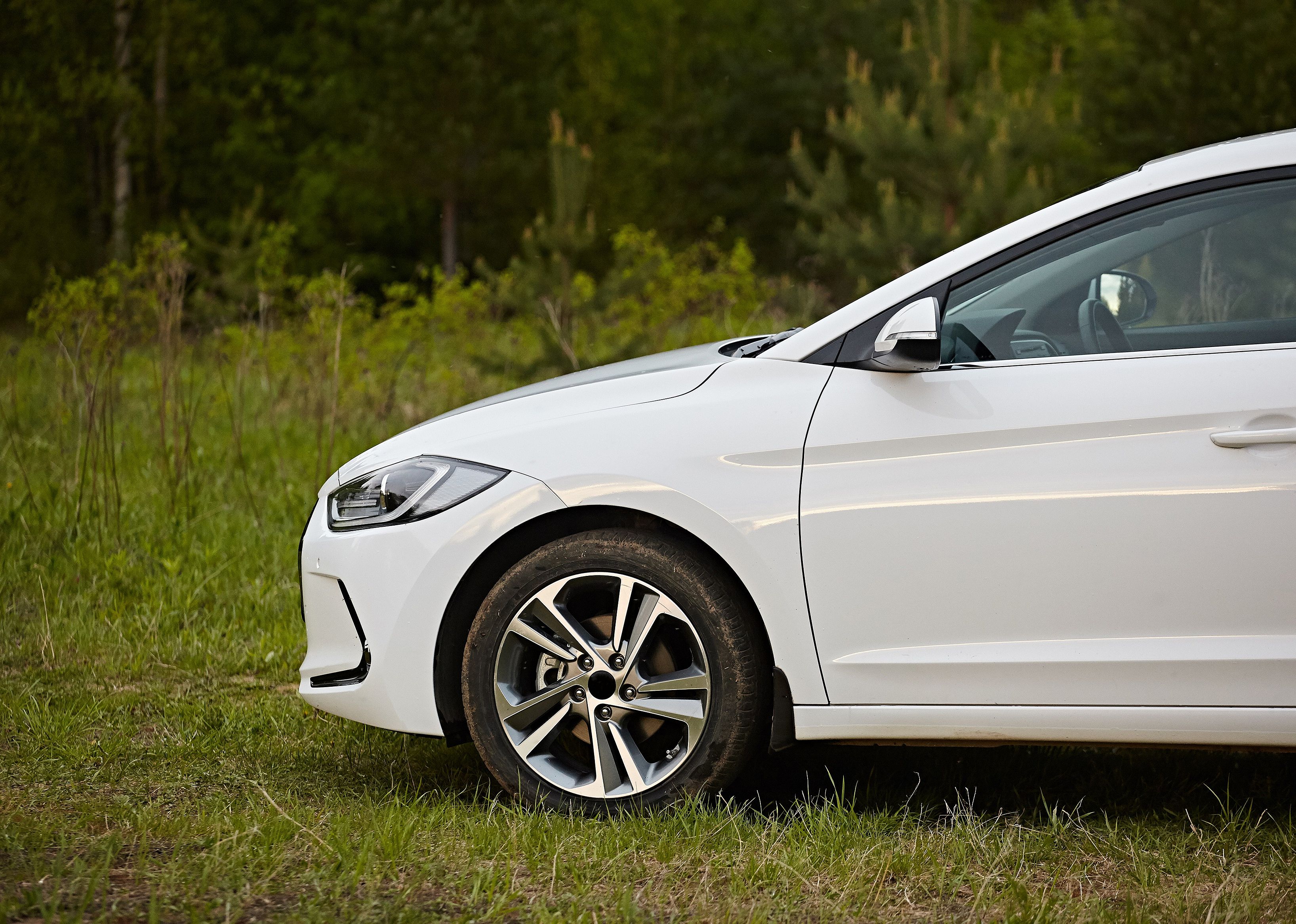 The front of a modern white car Hyundai Elantra.