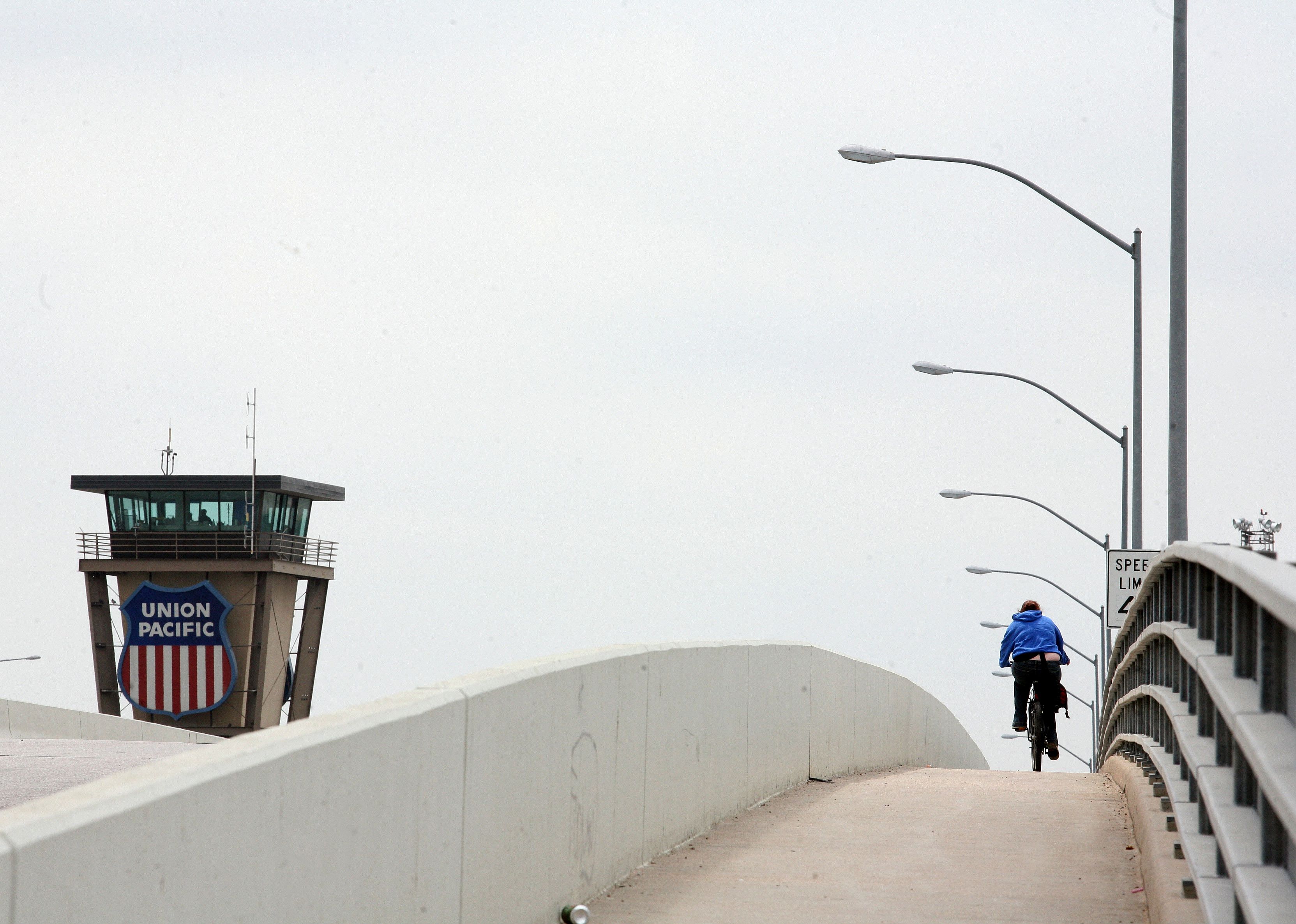 A bicyclist crossing the train tracks in Cheyenne