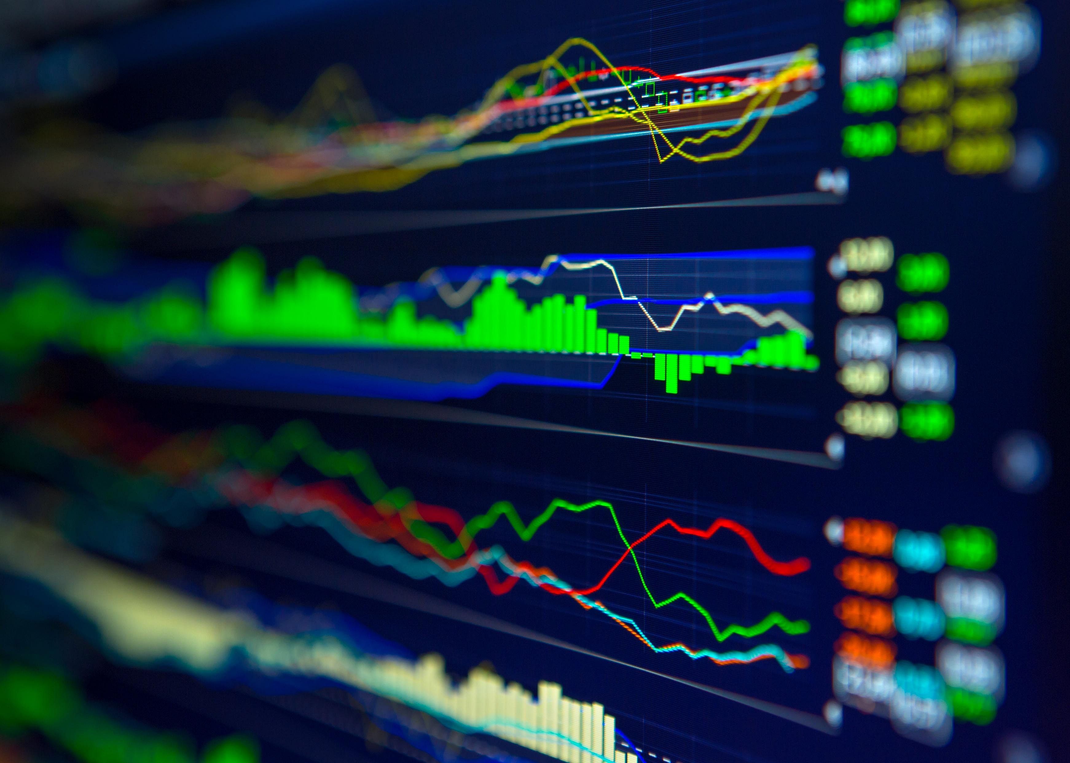 Technology graphs on a screen in multiple colors.