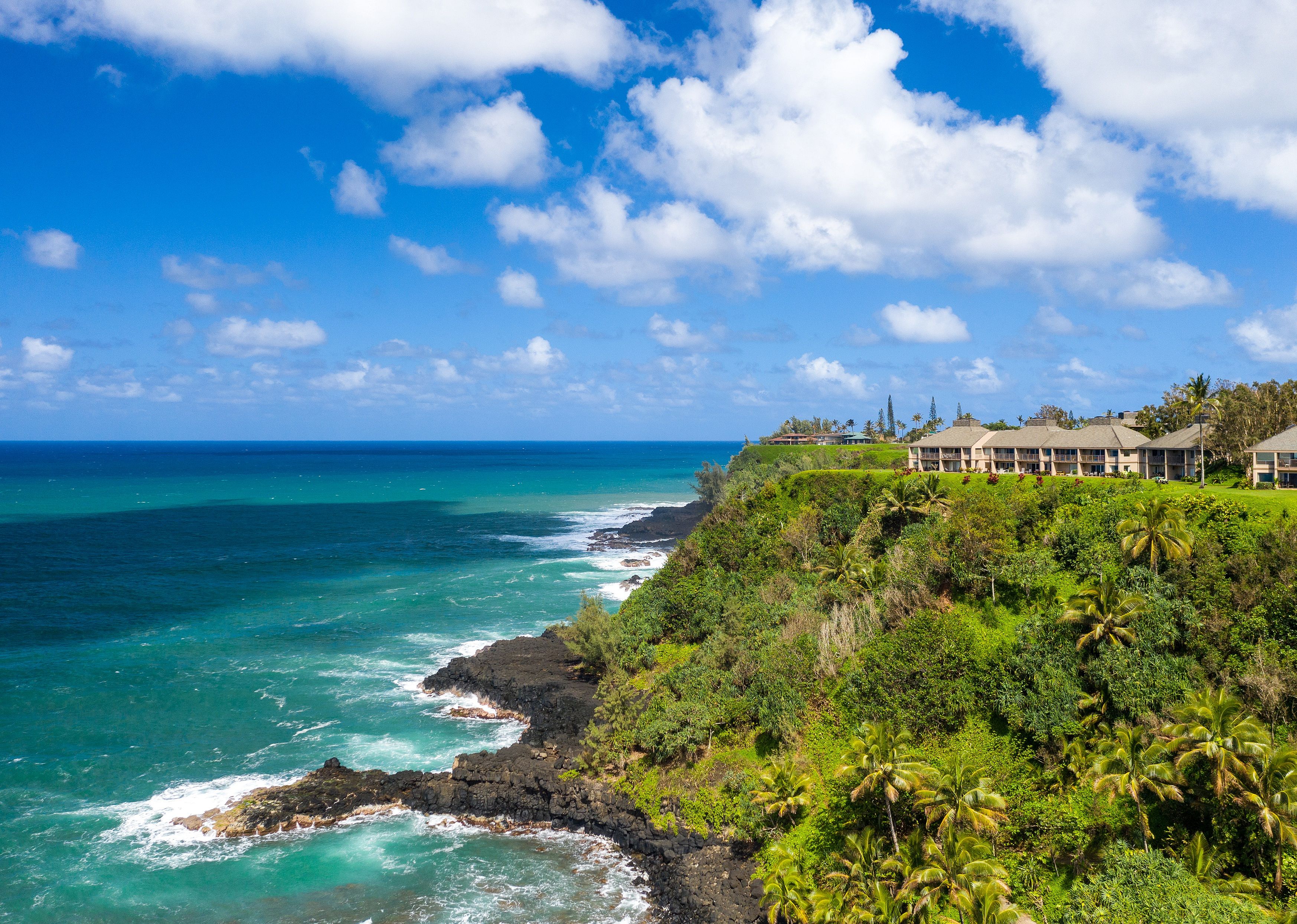 Aerial panoramic image off the coast over Princeville.