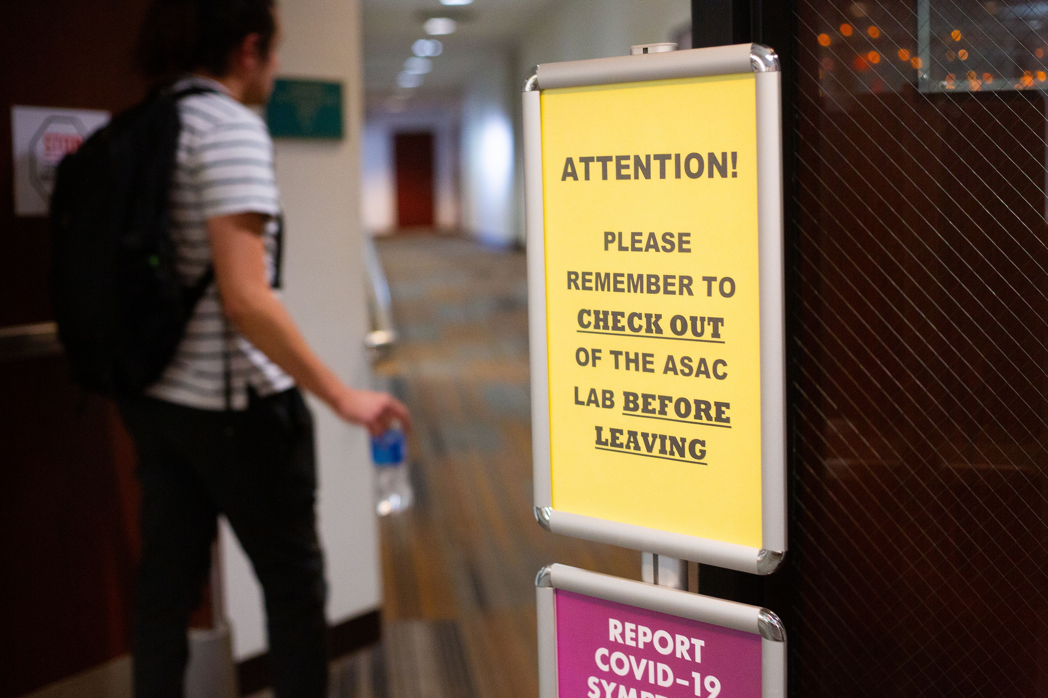 A sign posted outside a student tutoring center reminding students to check themselves out before leaving